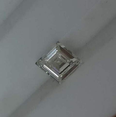 Does this lozenge shaped diamond look like the stuff of your bridal dreams? Secrète Fine Jewelry can help design the perfect ring around any shape of stone-- since we make all our own jewelry in centuries-old traditional methods, you're not confined to what will fit into pre-fab settings. We make each ring by hand to your specifications.