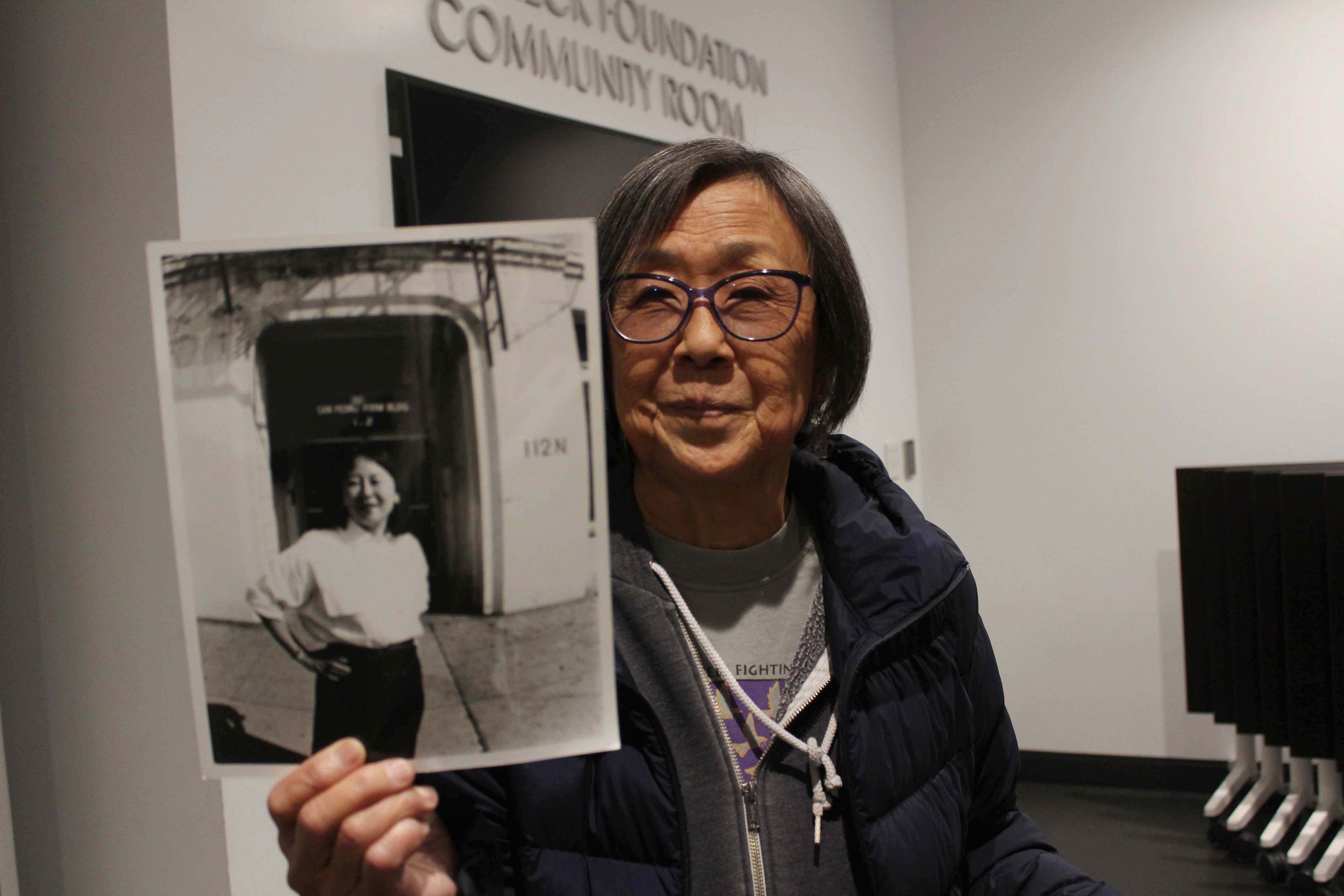 Kathy Masaoka with a picture of her sister Judy Nishimoto Ota