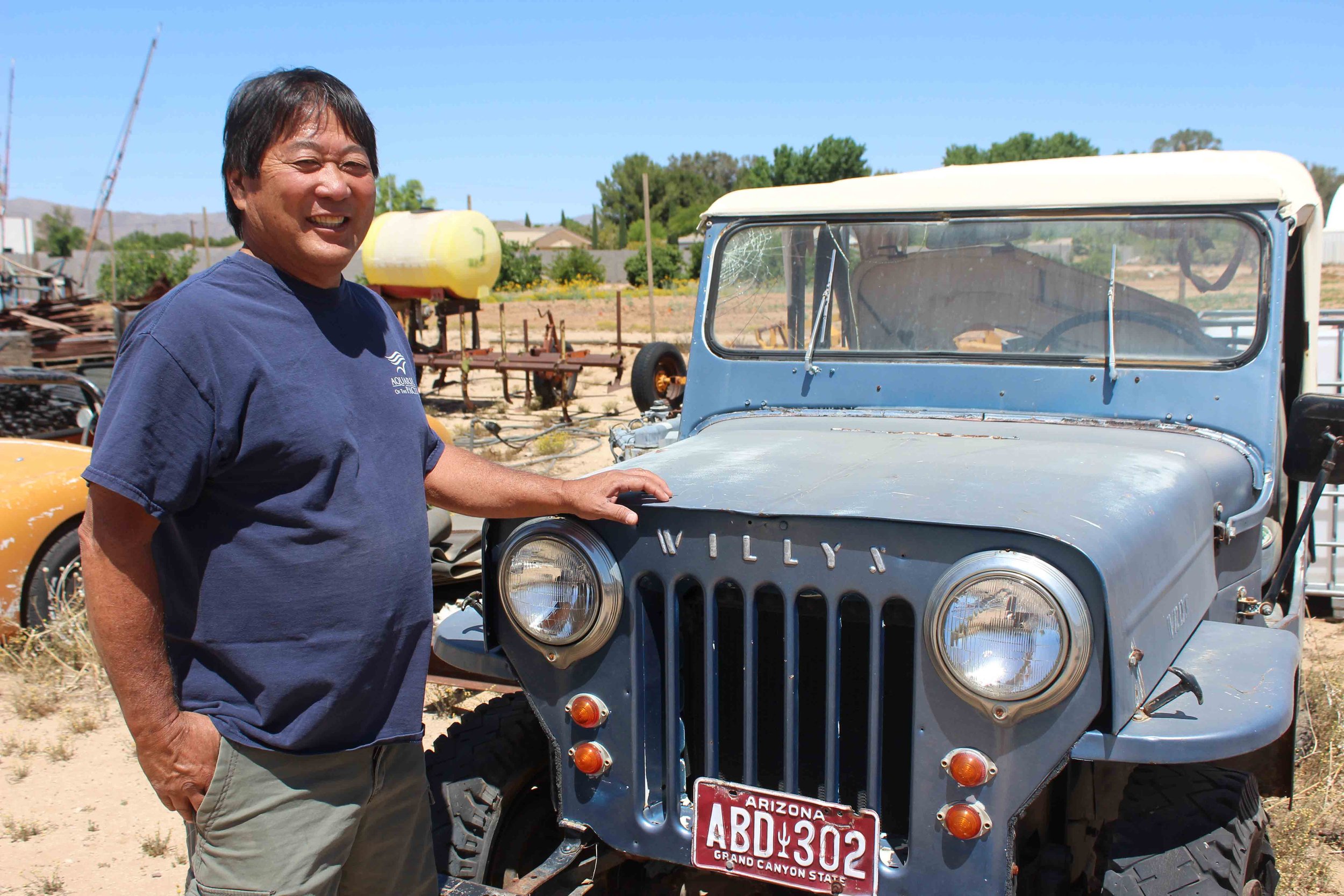 Russell Keith Tanita with his father's jeep