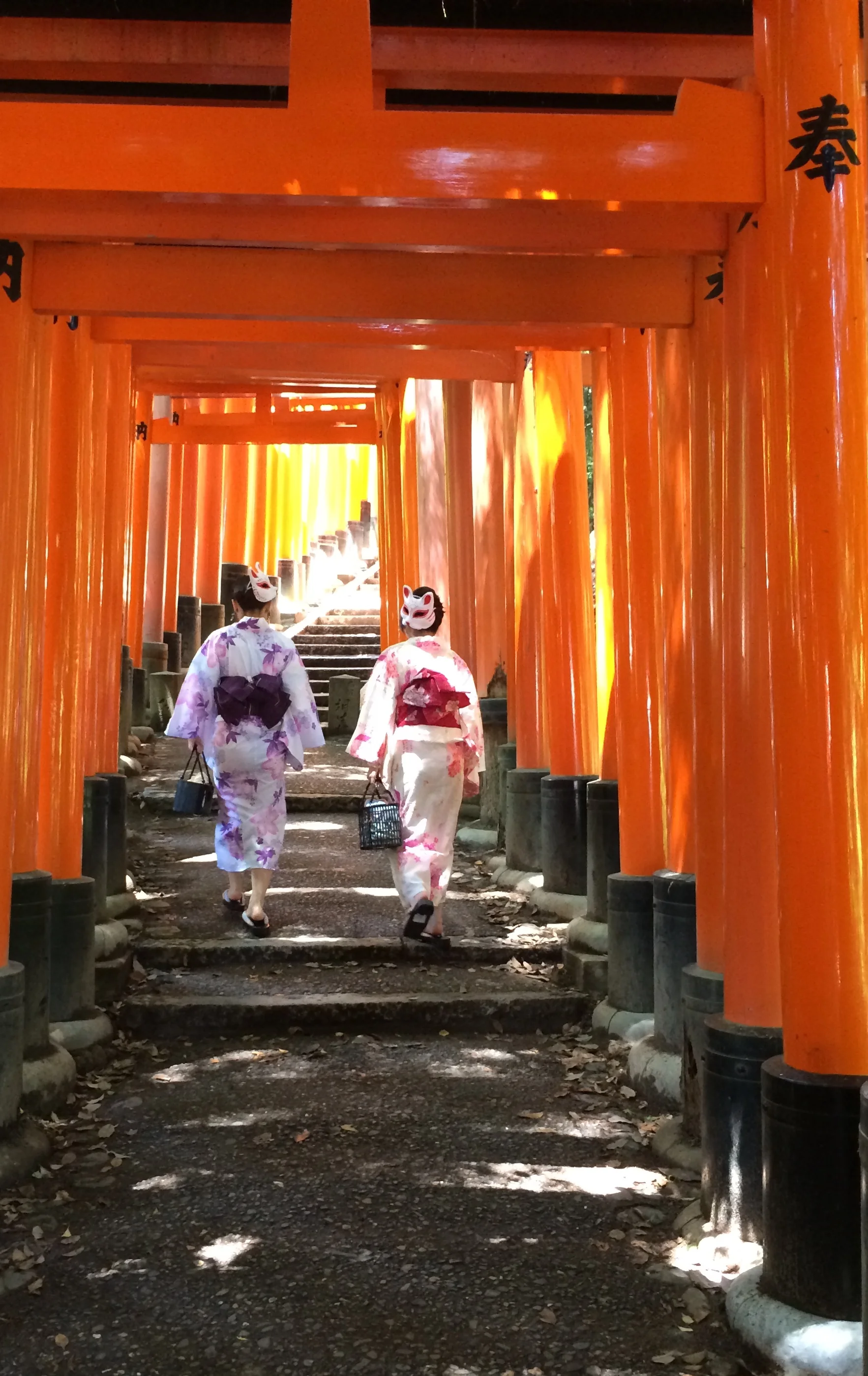 IN KIMONO & FOX MASKS AT FUSHIMI INARI SHRINE, KYOTO, JAPAN Photo by TK Feissner (TOP: TORII GATE AT FUSHIMI INARI SHRINE, KYOTO, JAPAN Photo by TK Feissner)