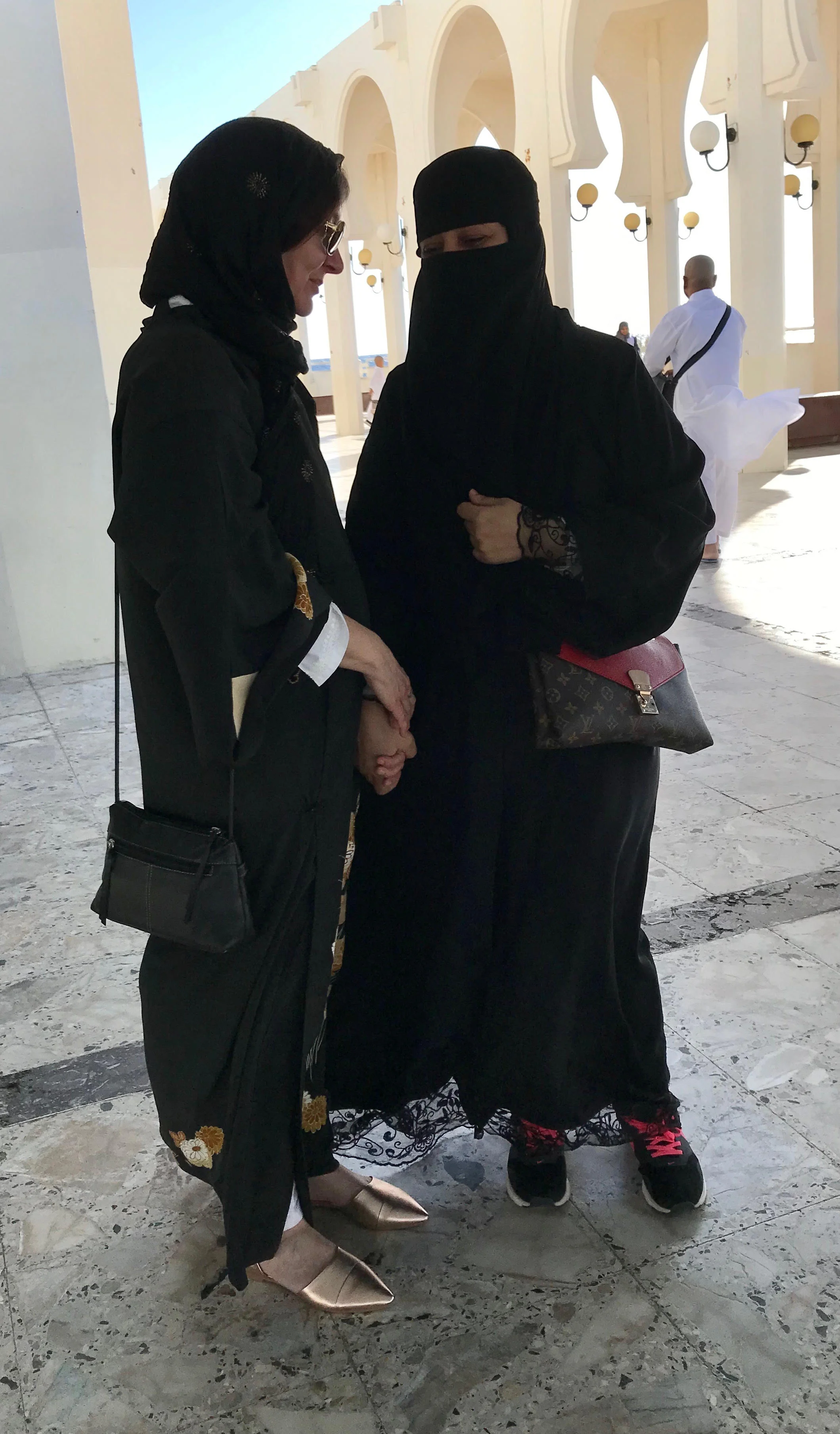 MAKING FRIENDS IN JEDDAH, SAUDI ARABIA Photo by TK Feissner (TOP: ISLAND MOSQUE, JEDDAH, SAUDI ARABIA Photo by Lisa Feissner)