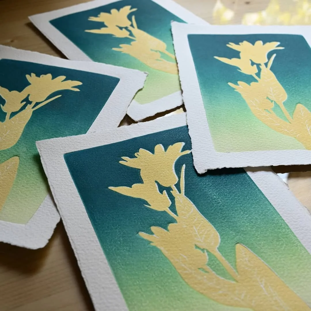 Here's a little peek at the first few layers of a relief print that'll soon be available in our shop! The imagery is of wild daisies and the print will be available with either a clean white background or the twilight colored background pictured here