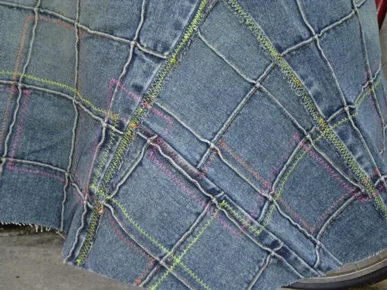 Close-up of contrast color stitching on denim