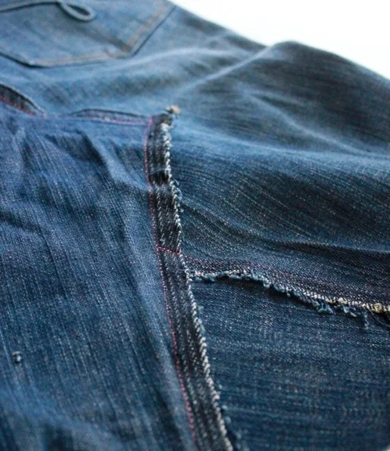 closeup of stitching a denim skirt