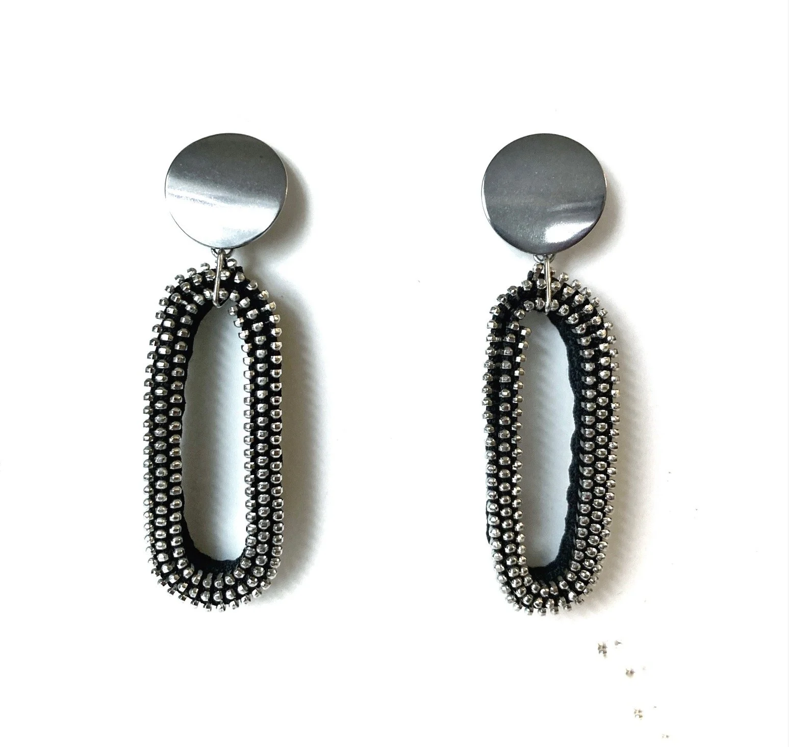 CUSACK_Oval_Max.blk:sil.zipperearrings.lowres.jpg