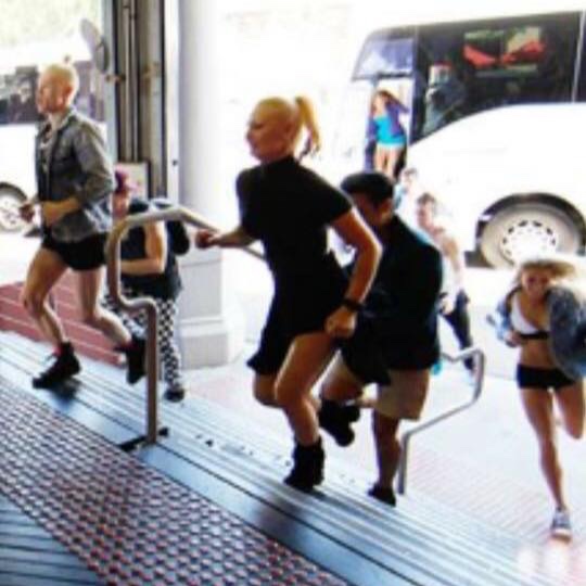 Running From Our Bus Into The Competition