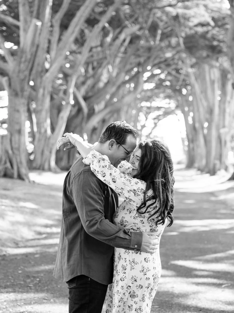 couple smiling and laughing during their photoshoot