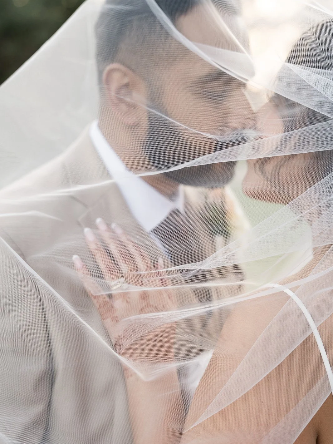 Bride and groom under the veil