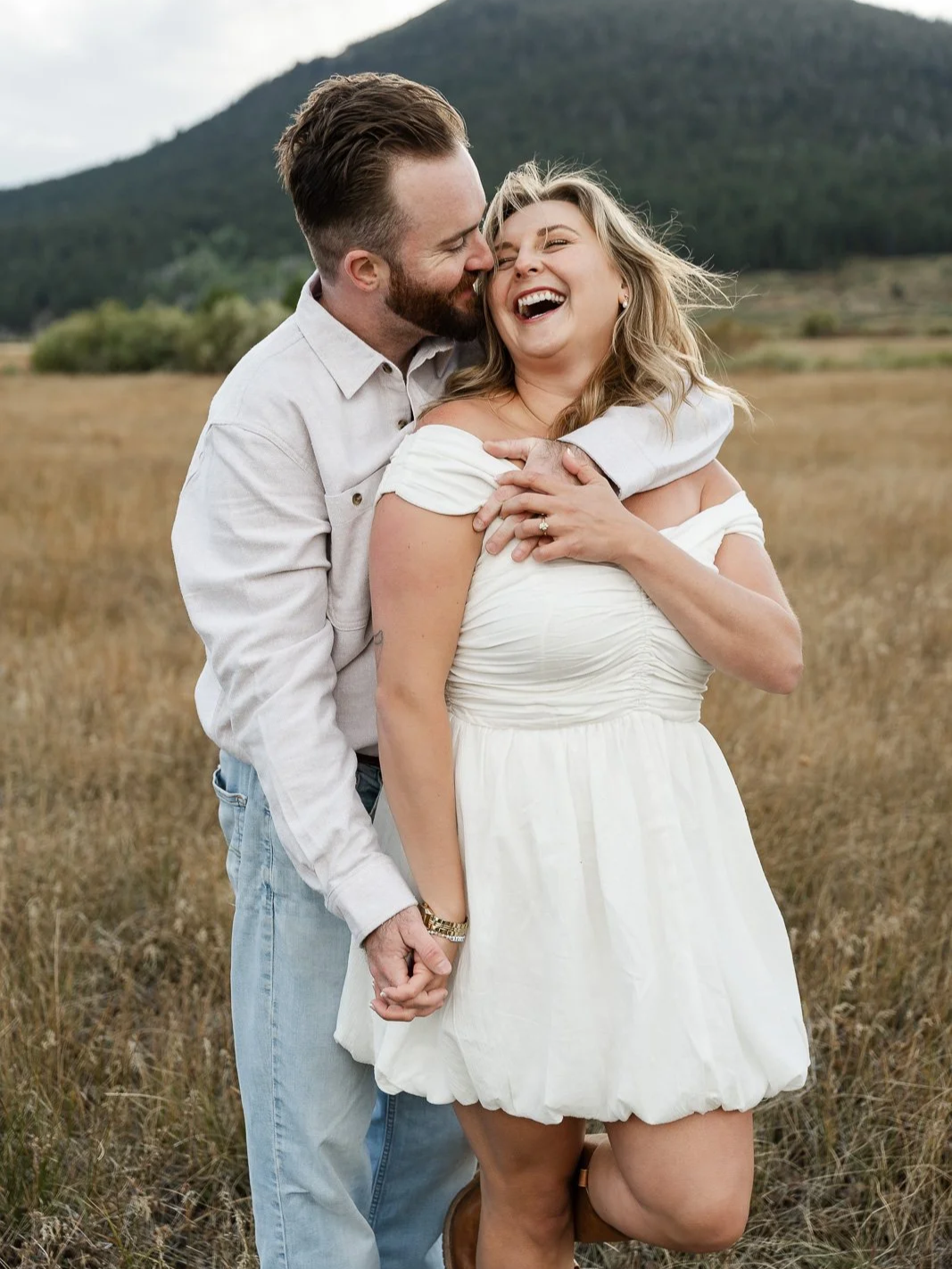 fun candid laughing moment between the couple