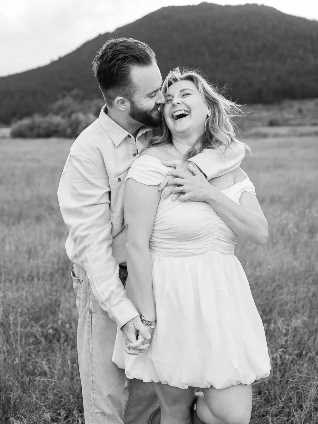 fun candid laughing moment between the couple