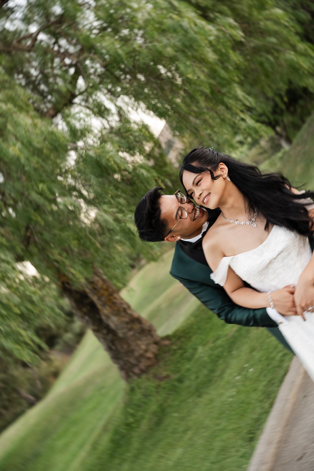 bride and groom being playful laughing and smiling