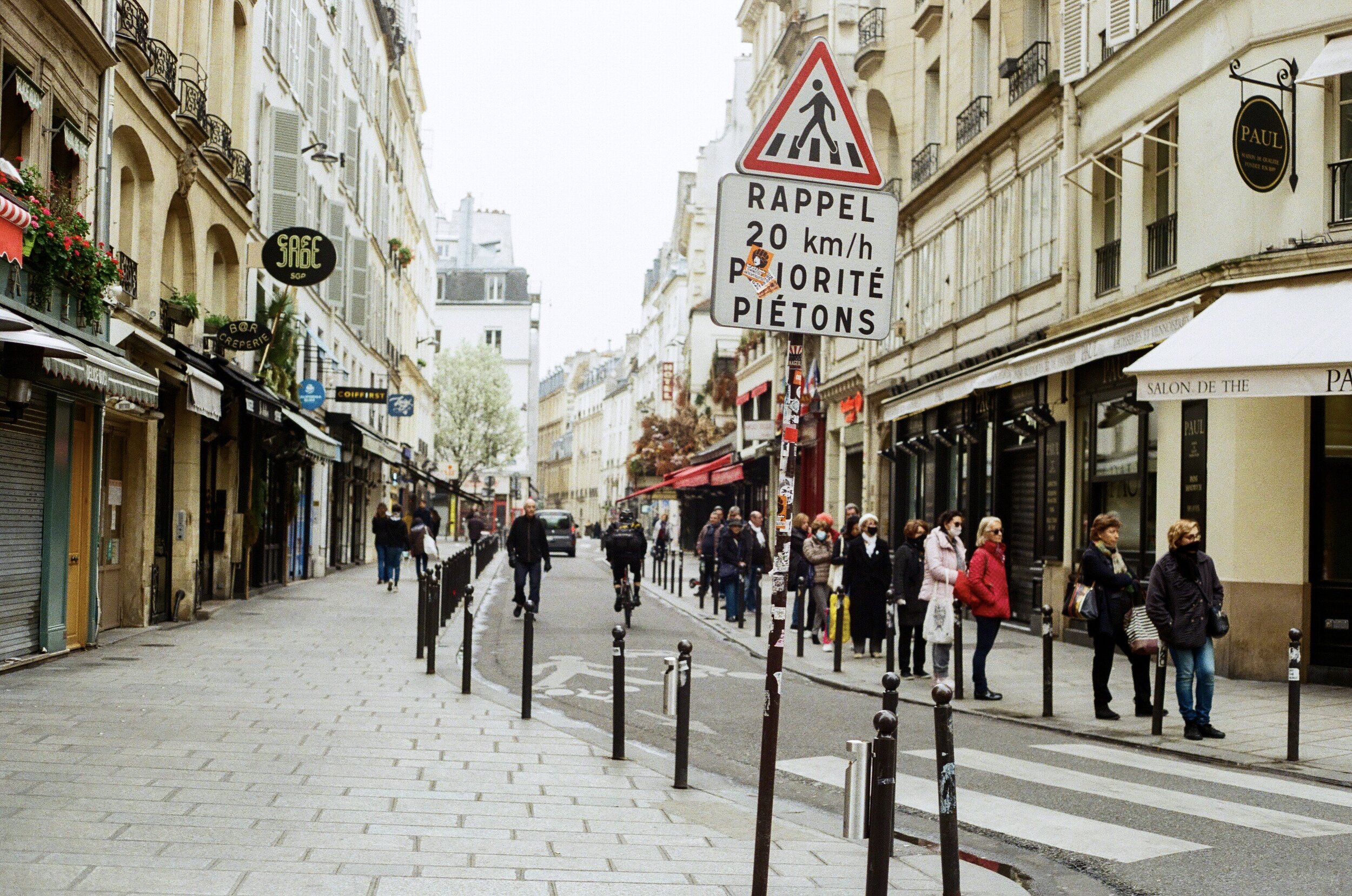   Normally filled by a dozen lively cafés and crowded with tourists, the Rue de Buci appears empty the morning of the lockdown.  