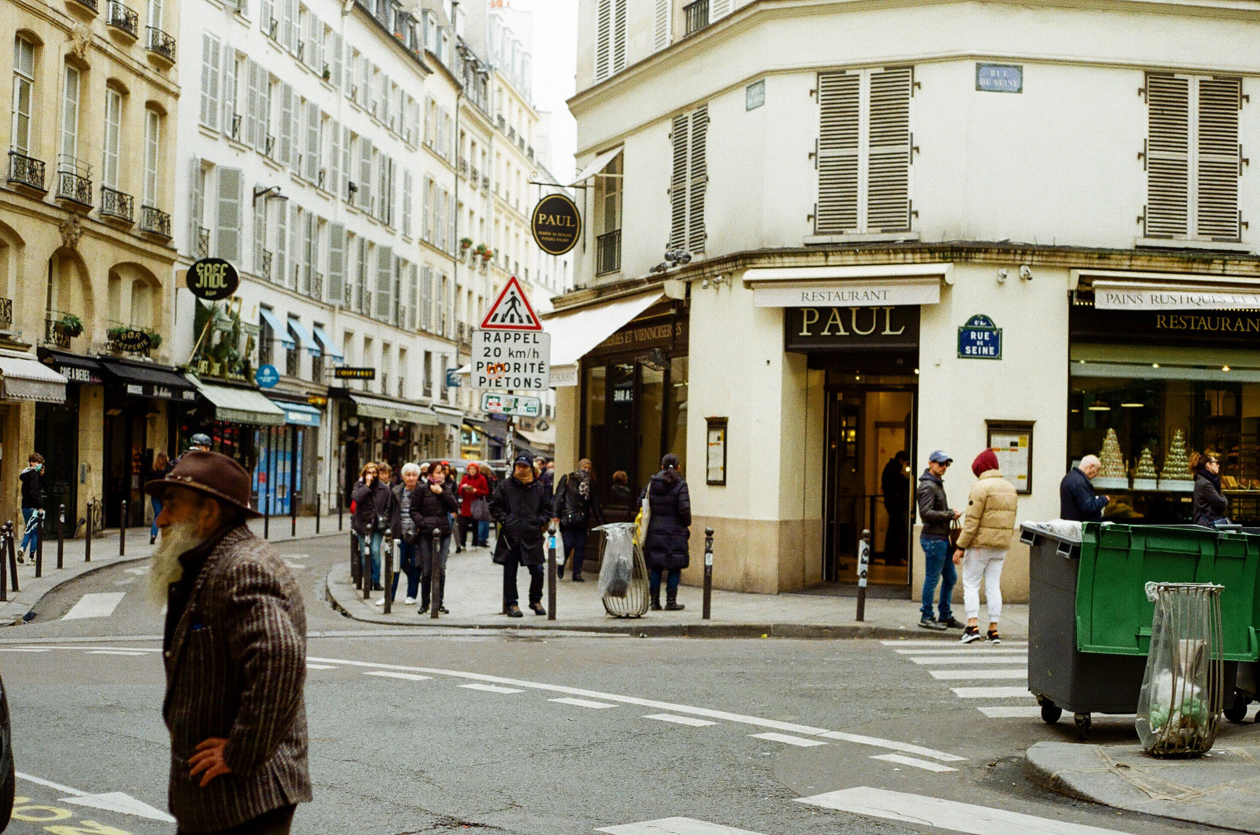   A line forms at Paul, one of two bakeries still open on the Rue de Buci on March 17th.  