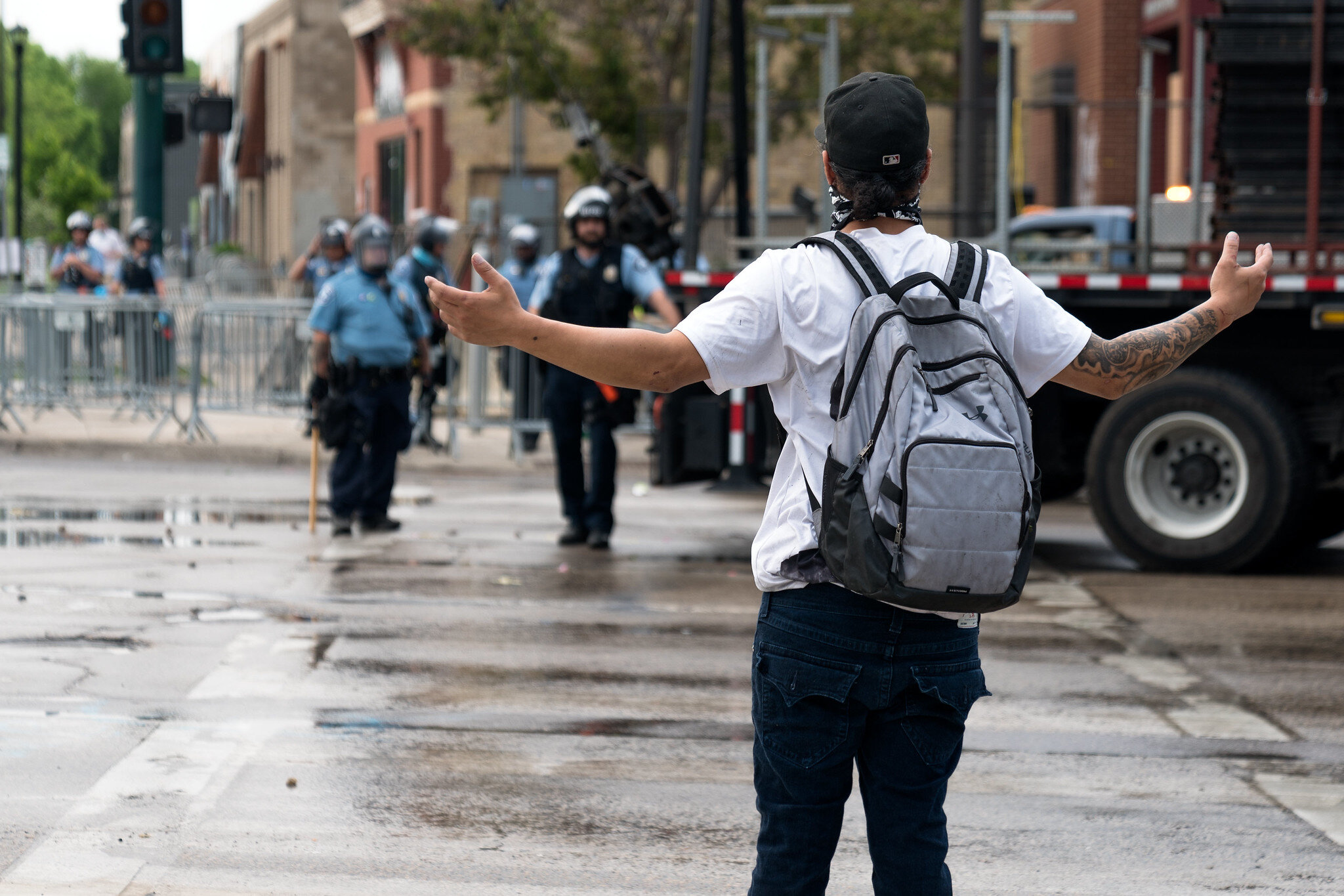  A protester confronts police officers on Thursday morning outside the 3rd Police Precinct in Minneapolis, Minnesota 