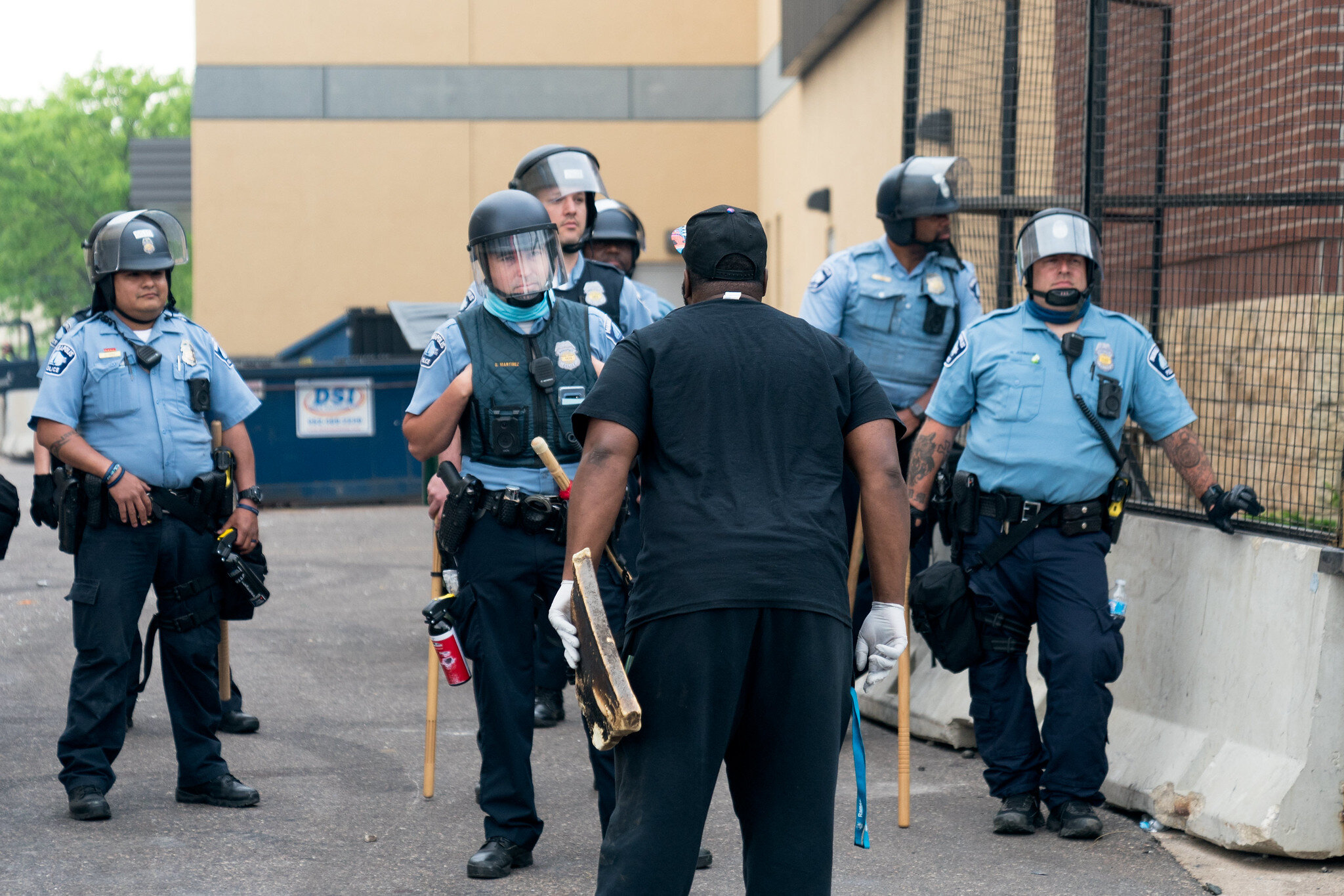  A protester confronts police officers outside the 3rd Police Precinct on Thursday morning in Minneapolis, Minnesota 
