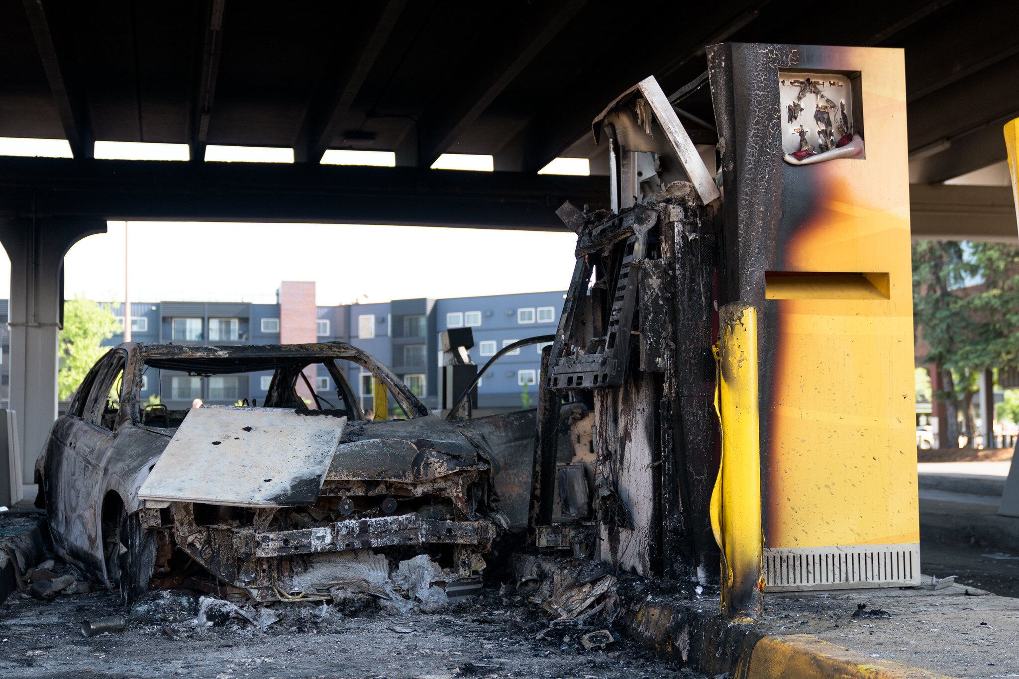  A burned out car and ATM drive thru machine at Wells Fargo Bank on Saturday morning after they were destroyed by rioters on Friday night in Minneapolis, Minnesota 