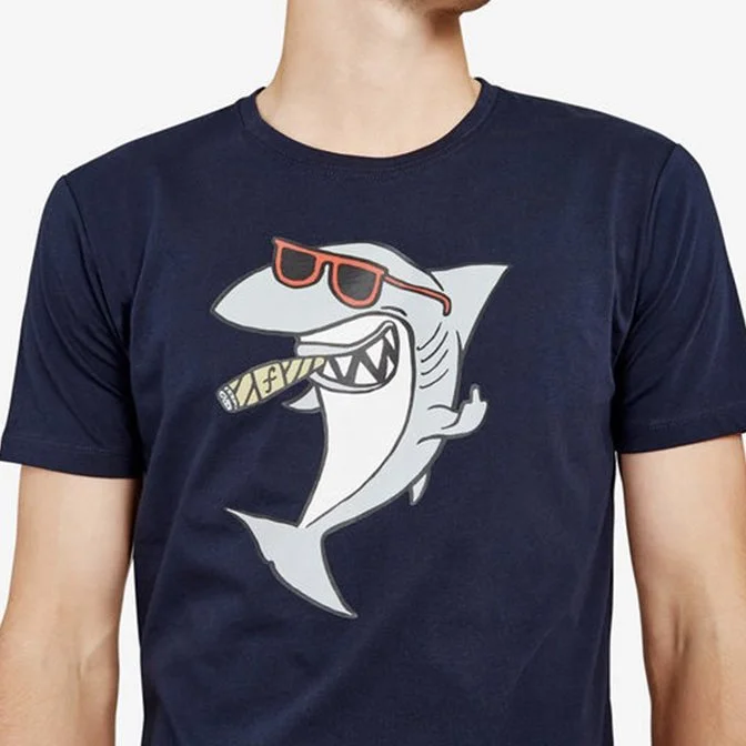 Navy t-shirt with a cartoon shark wearing red sunglasses and holding a cigar in its mouth.