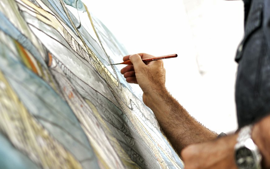 Showing Matt Broughton working on a painting