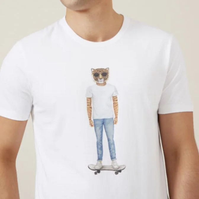 White t-shirt featuring a graphic of a person with a tiger face, wearing a white t-shirt and jeans, standing on a skateboard.