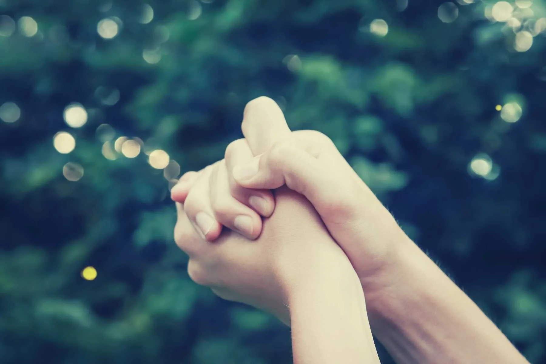 Hands catching the essence of a person as part of writing the eulogy