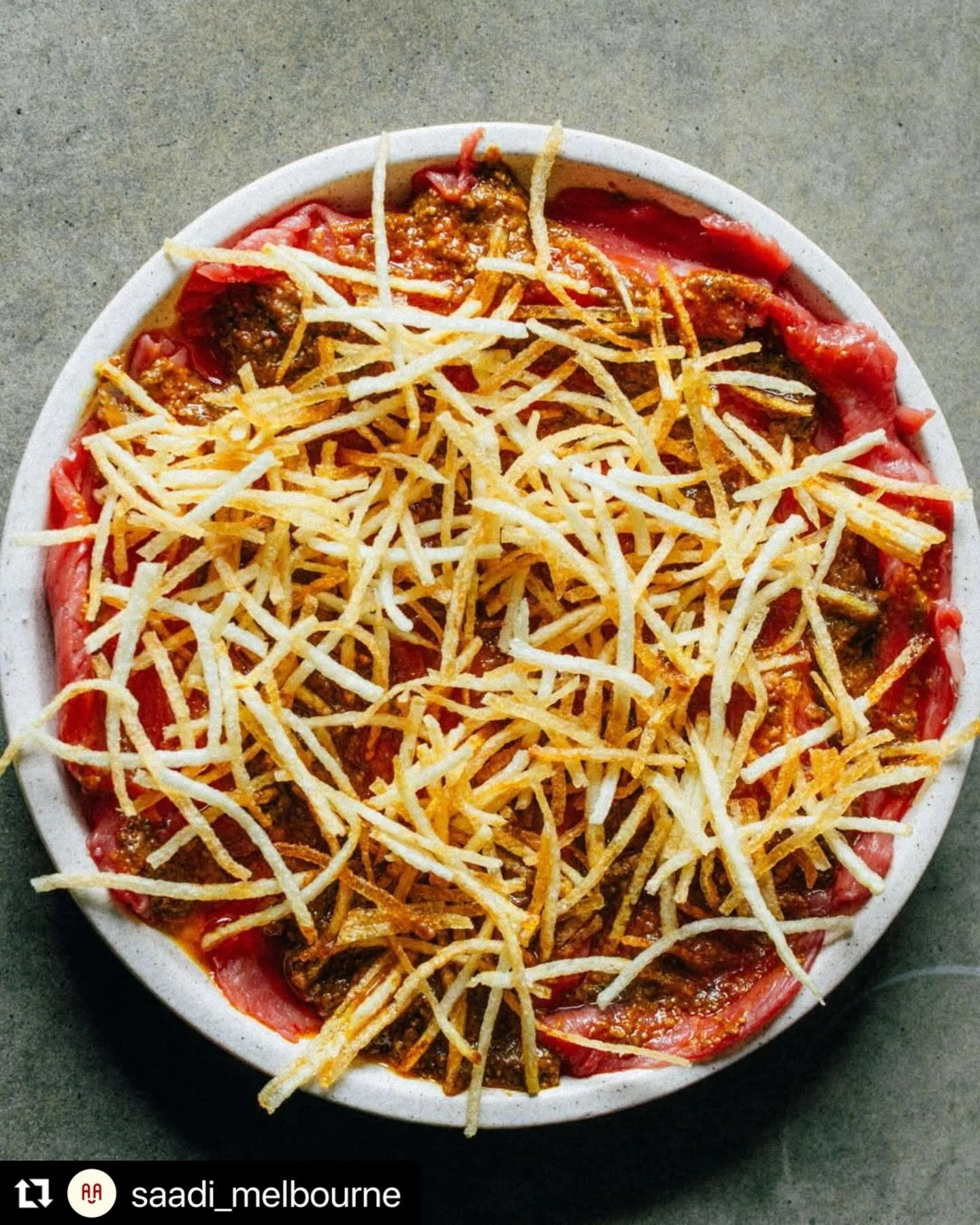 Salli Boti

 Southern Ranges beef, tenderised into a carpaccio of sorts, brushed with bone marrow, topped with a dressing that uses the same spices as the original curry and then finished off with some (lots) of potato fries.  Part of a delicious lun