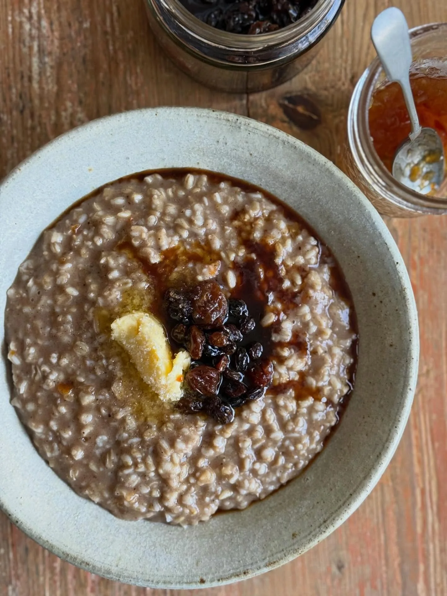 My hot cross bun inspired porridge.
For 2 cups of cooked porridge, add half a teaspoon of cinnamon, allspice and a pinch of nutmeg and cloves. A heaped tablespoon of orange marmalade, some vanilla and stir well.
Top with currants and raisins that hav