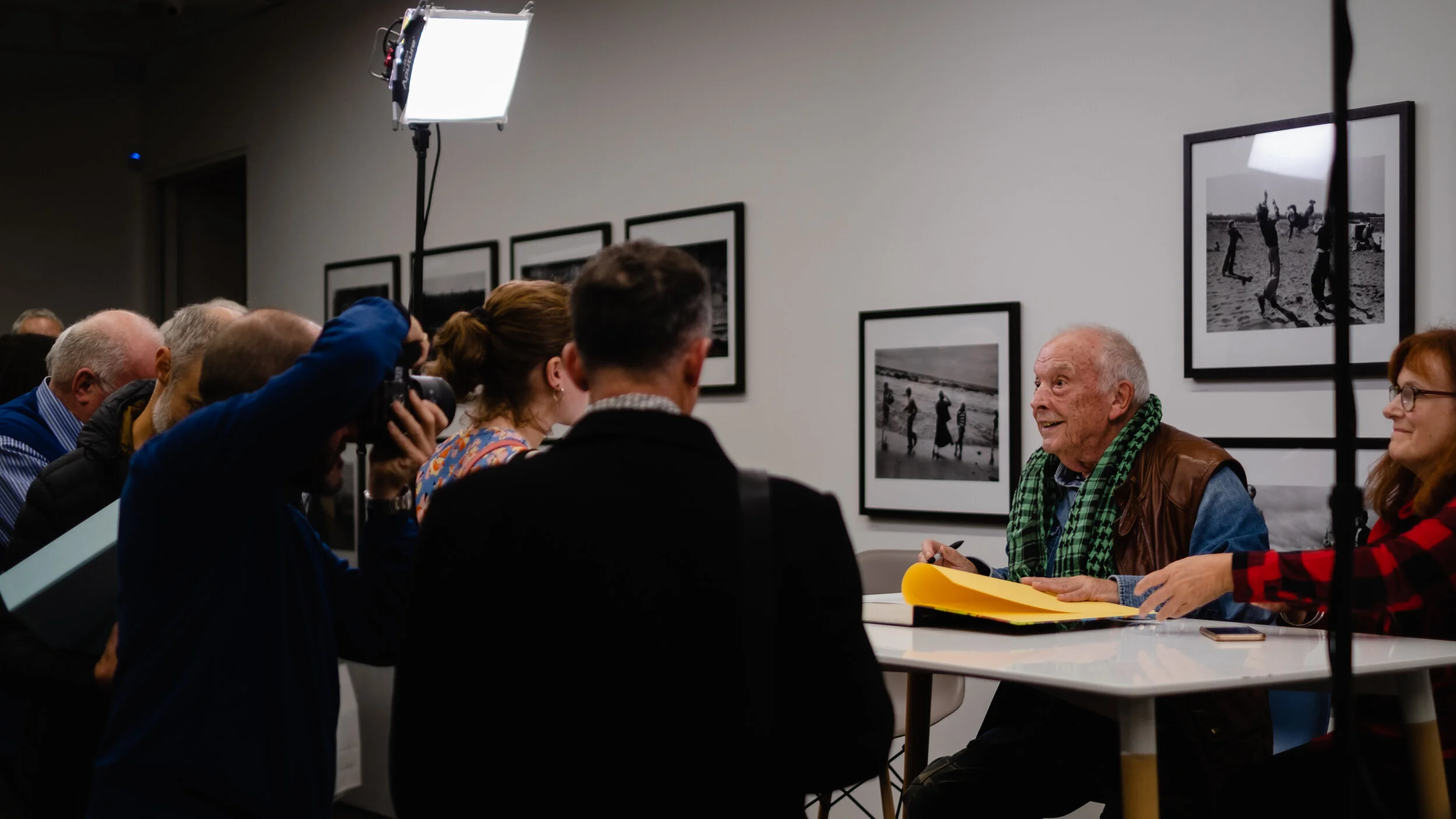David Bailey poses for a photographer while book signing / © 2019 Tracey Paddison