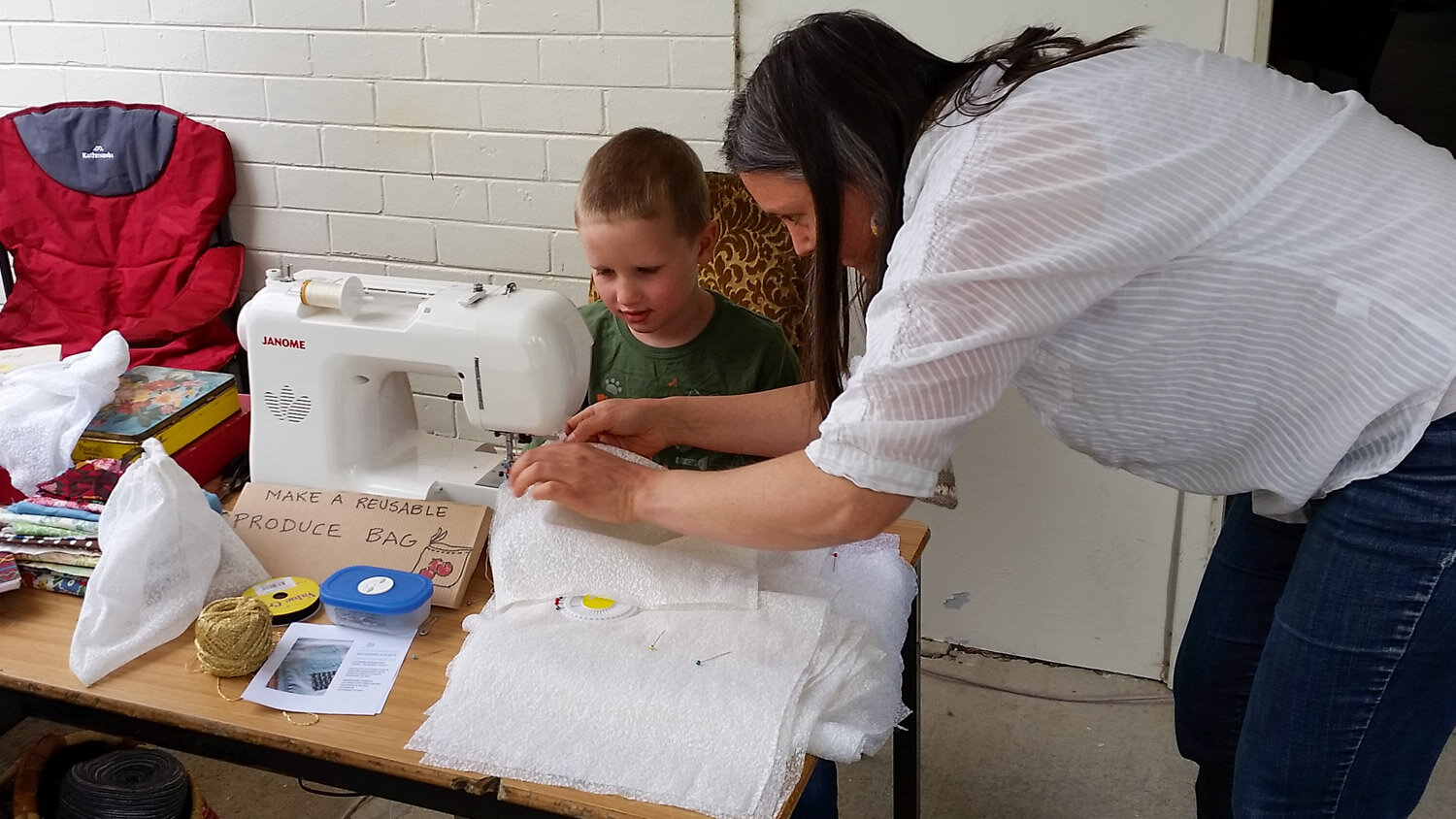 young boy sewing.jpg