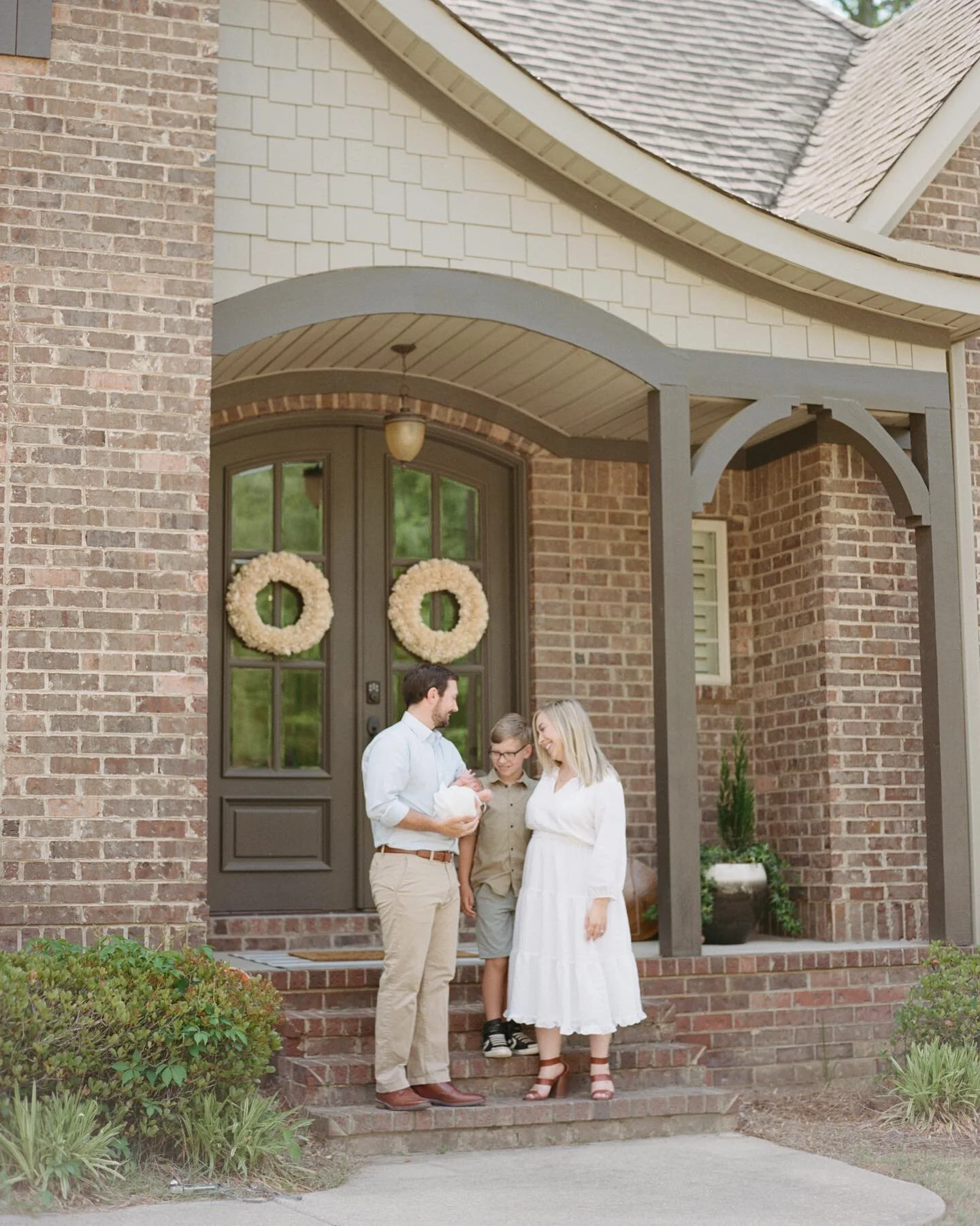 If time allows during a newborn shoot, I love bringing everyone outside for a shot in front of the house. I imagine them looking back on it and remembering all the sweet memories made in that first childhood home.