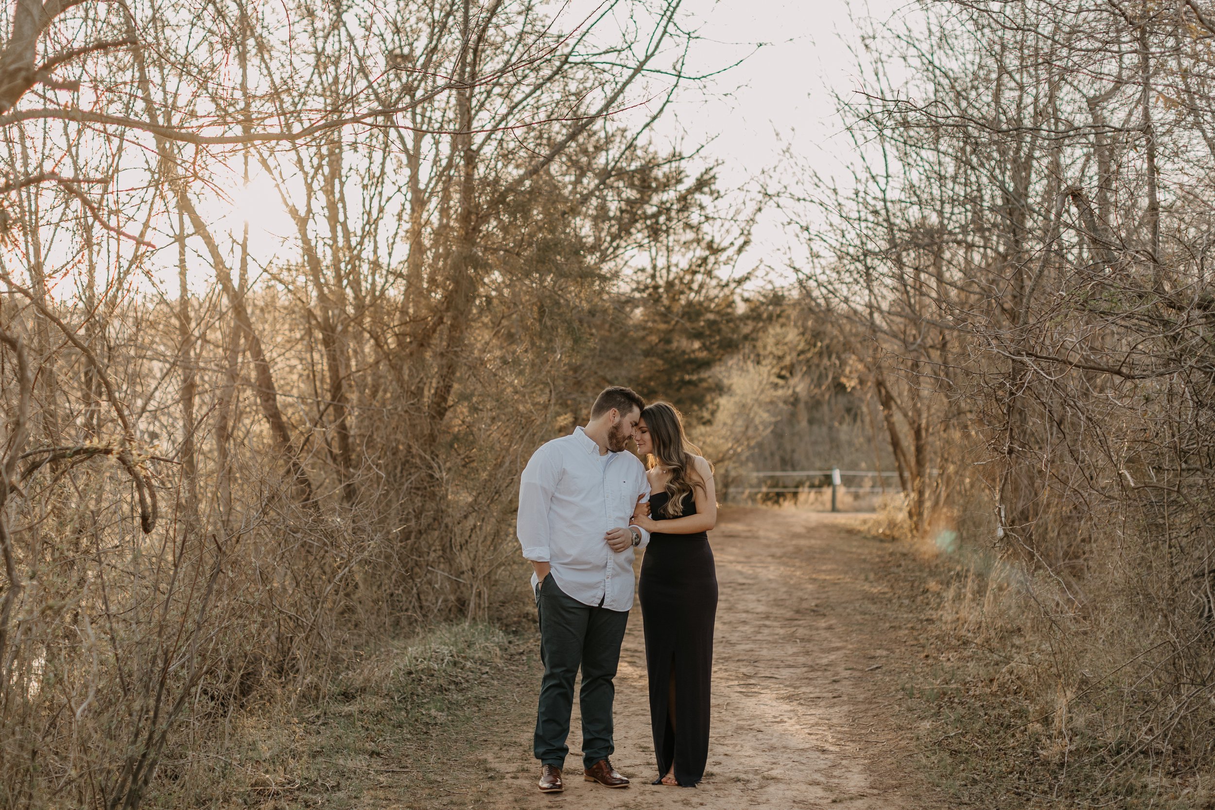 A newly engaged couple taking engagement photos at Claude Moore Park in Sterling, Virginia