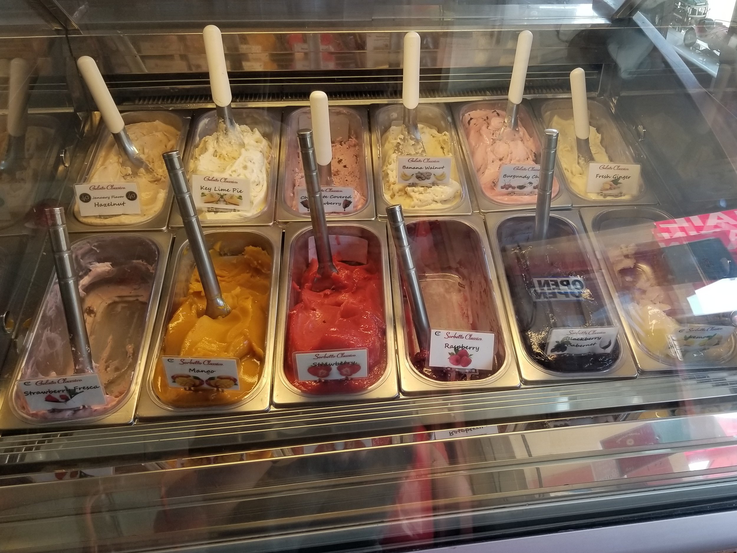 A freezer case filled with gelato.