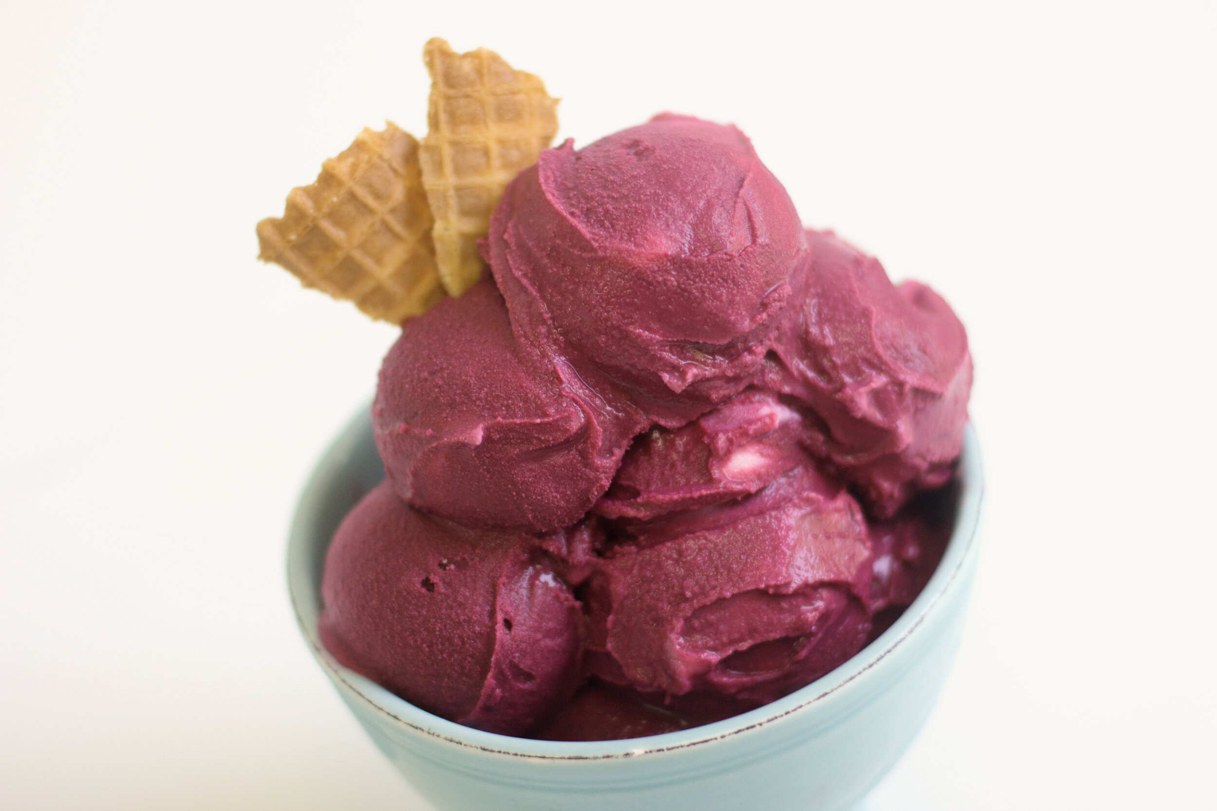 Raspberry sorbet with triangular wafer cookies