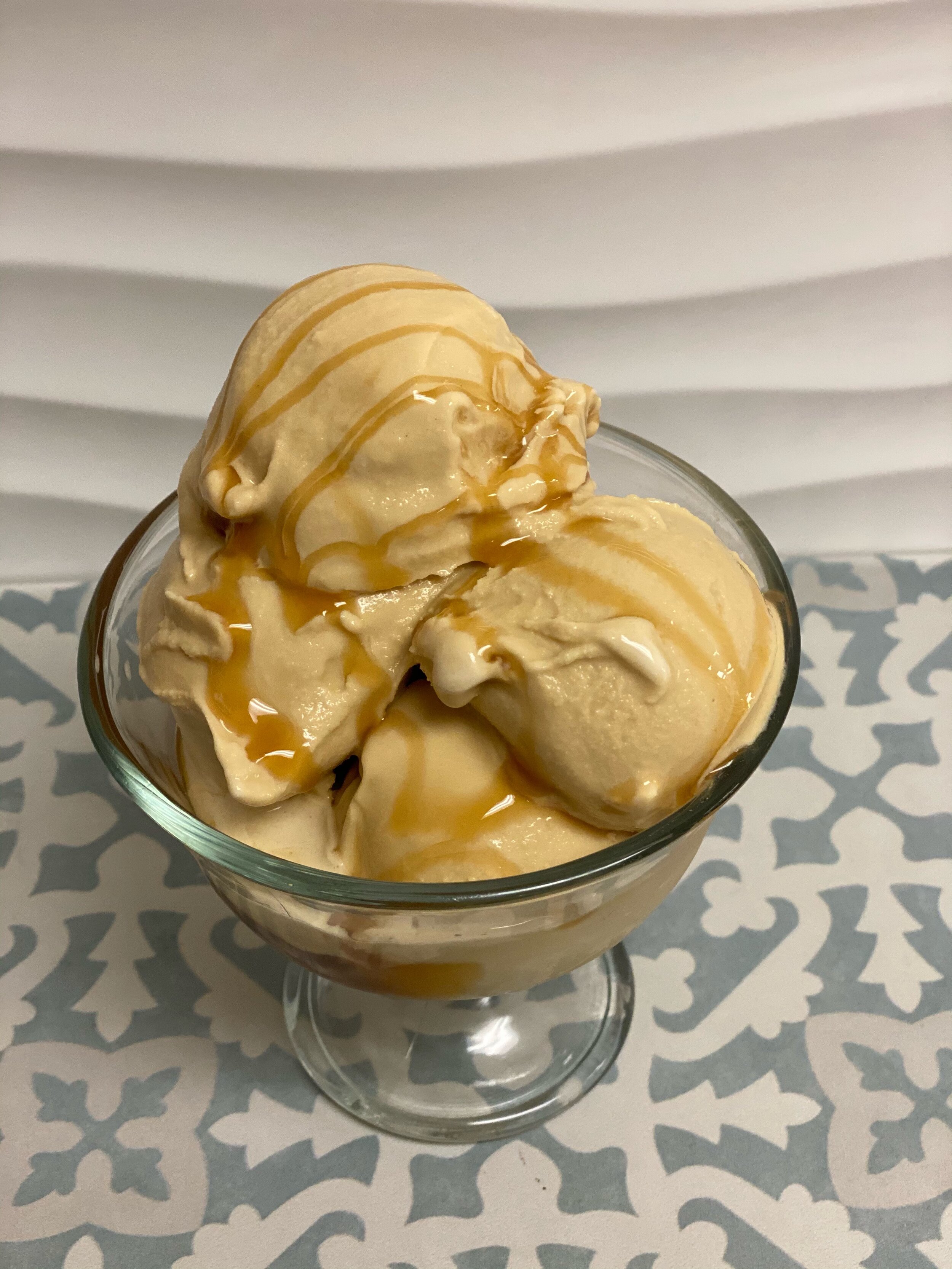 Scoops of creamy gelato in a glass bowl