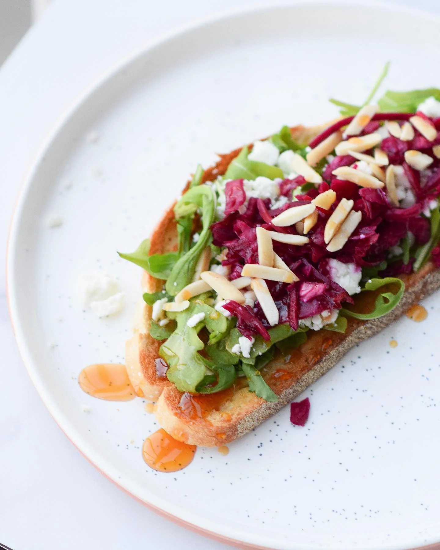 Best meal of the day = combining all your leftovers into a healthy bfast toast 💖

▫️sourdough
▫️arugula
▫️goat cheese
▫️shredded red cabbage
▫️sliced almonds
▫️spicy honey drizzle

💖💫🔥 love,
your new fav toast