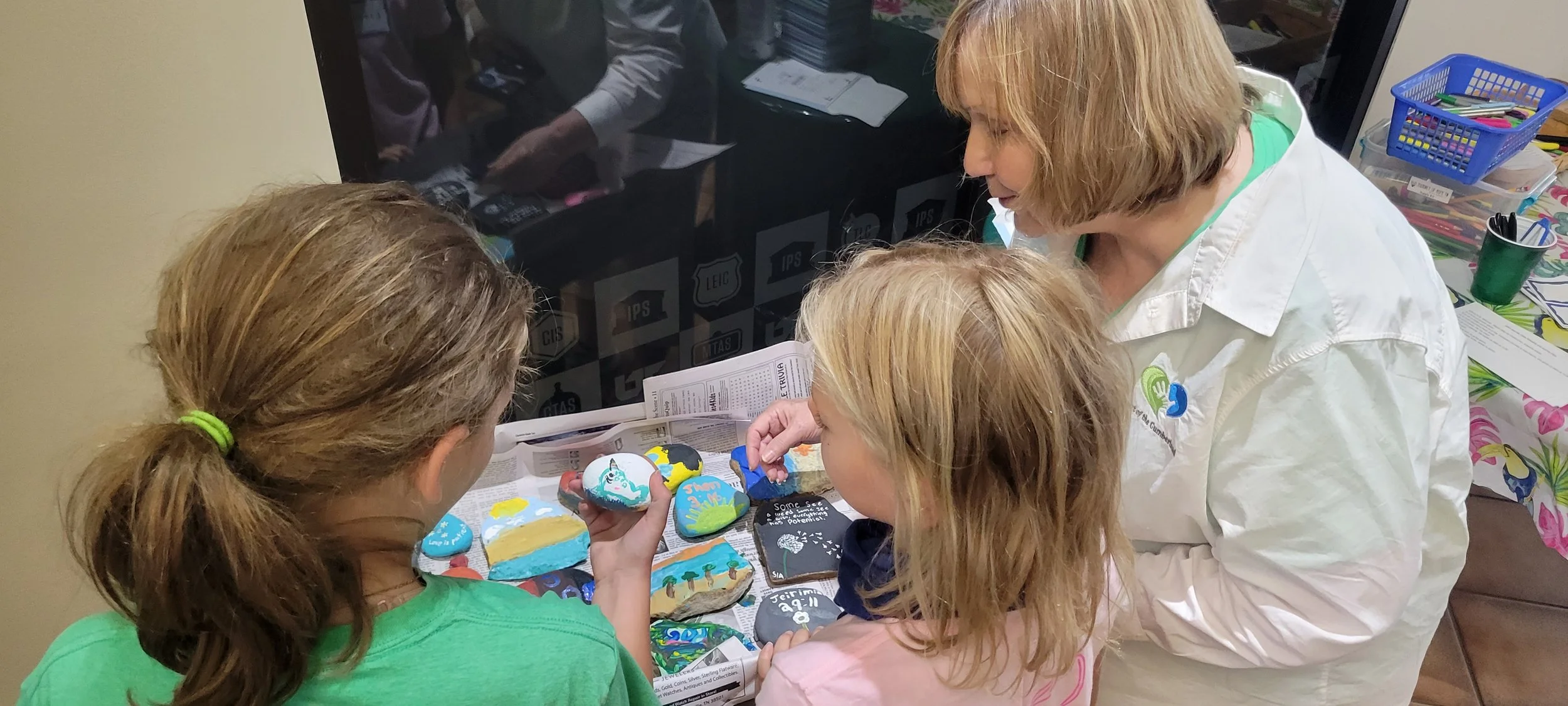 2022 Journey Camp rock painting Dianne with campers.jpg