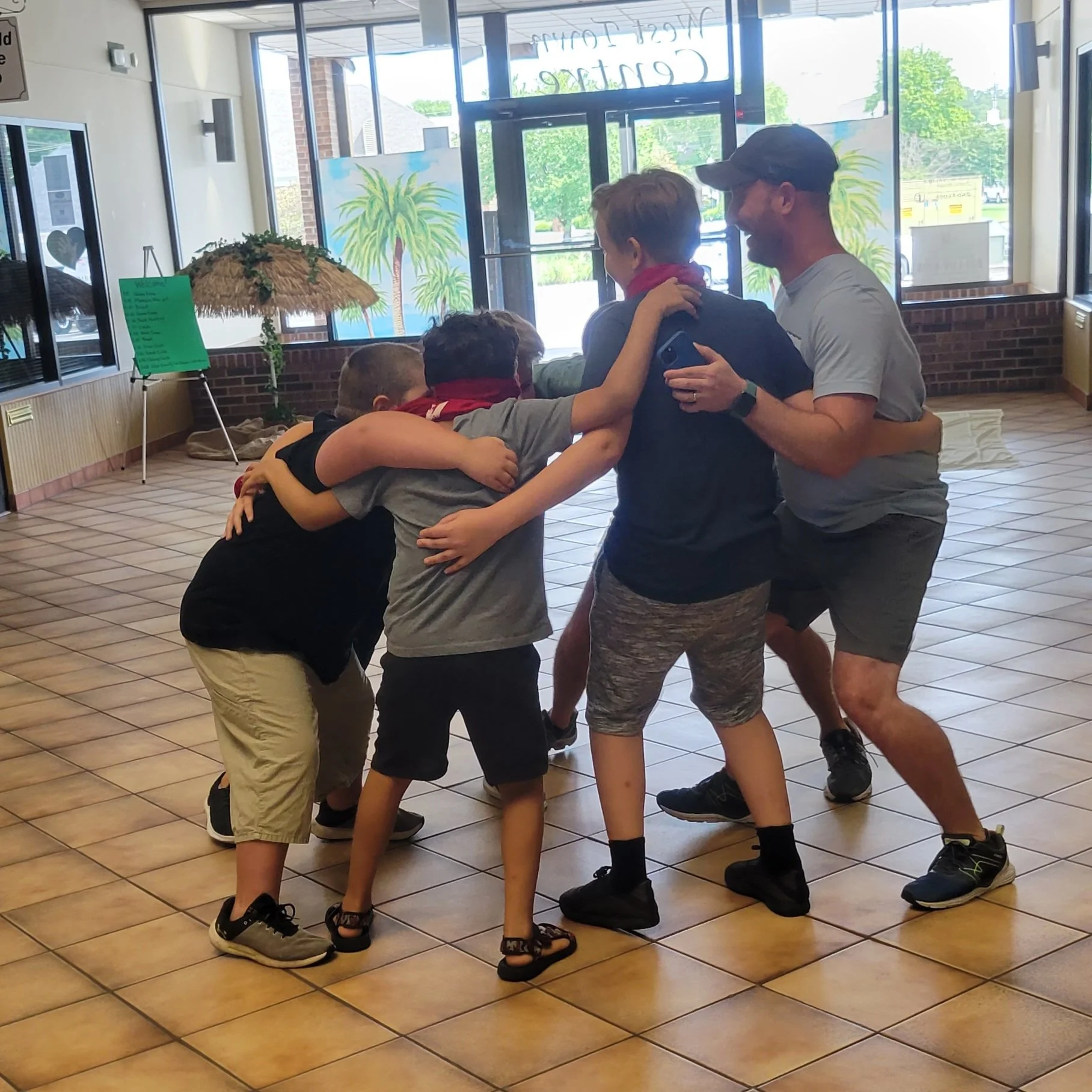 2022 Journey Camp Chris wtih boys huddle.jpg