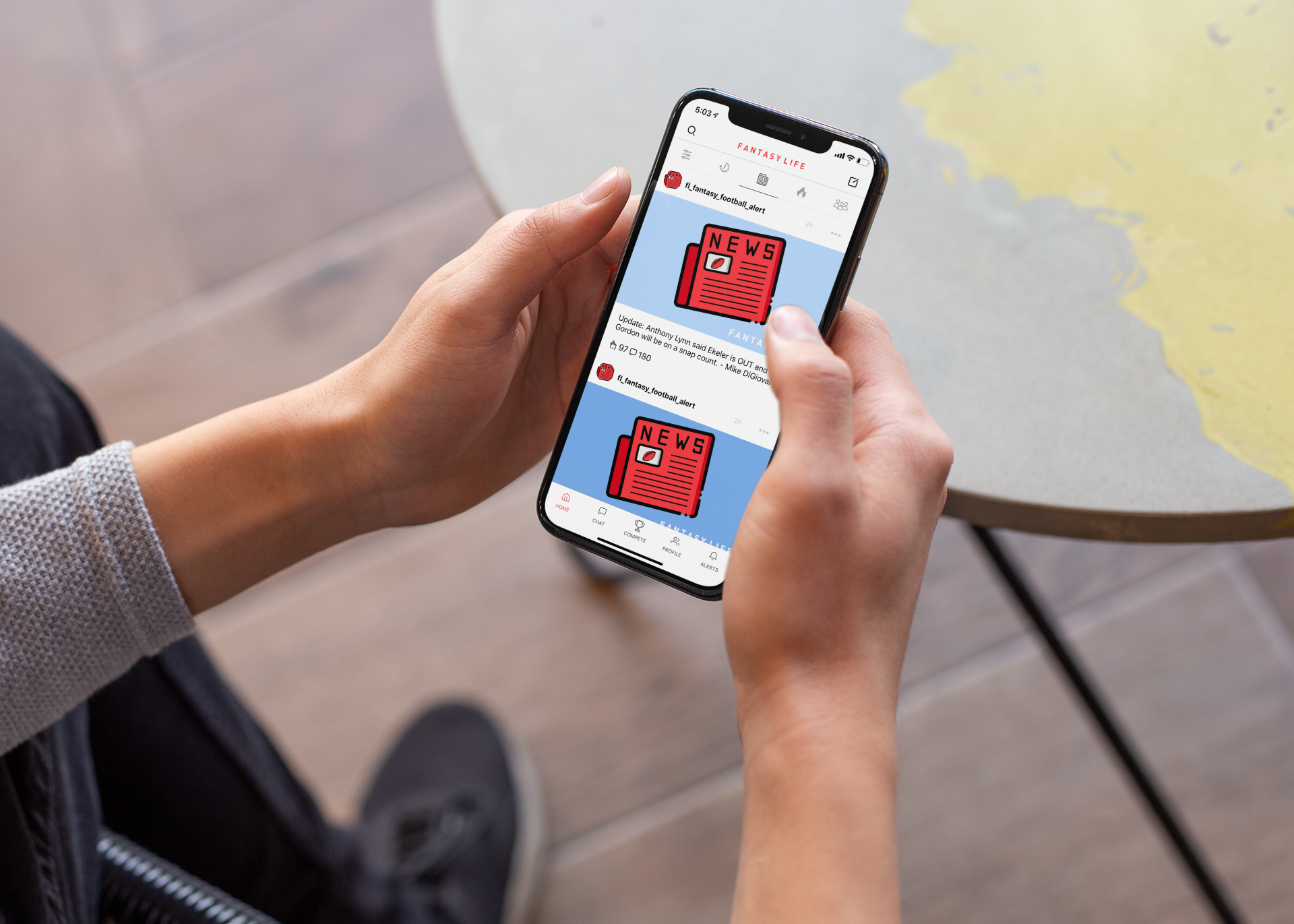 mockup-of-an-iphone-xs-held-by-a-man-outside-25532.png