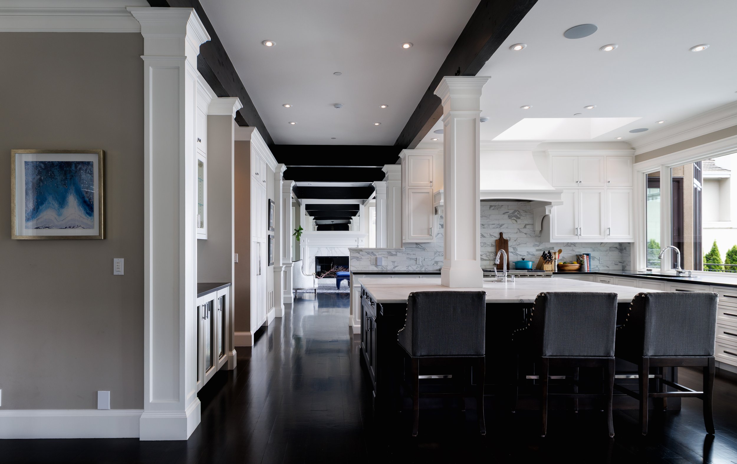 View to Kitchen with Dining and Living Rooms beyond