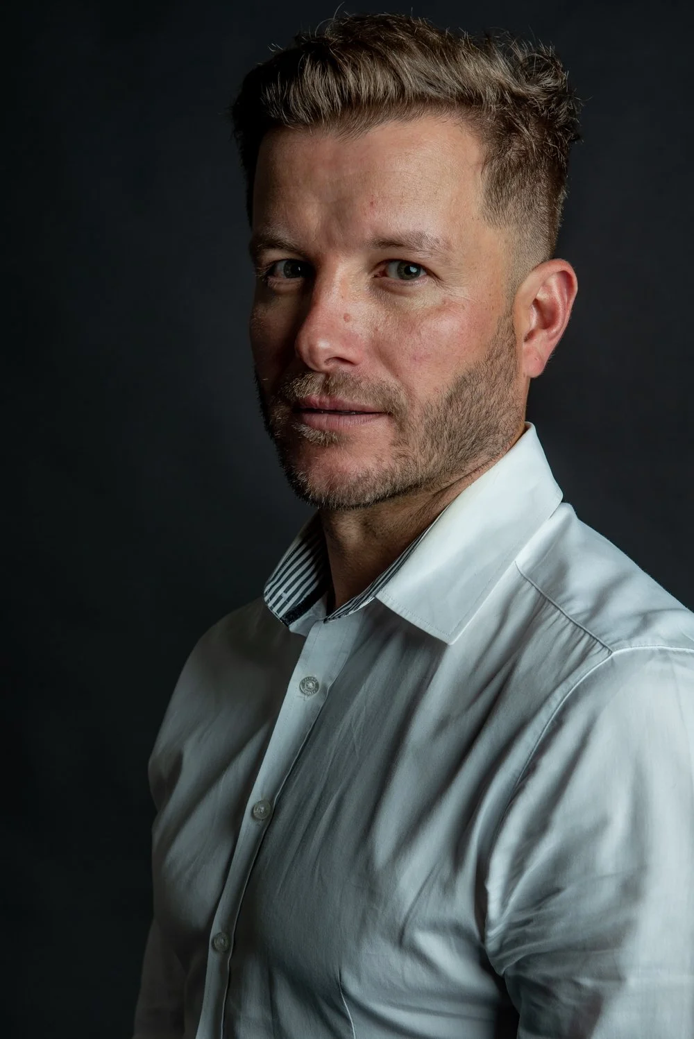 Actor and television presenter Luke Jacobz photographed in a modern, cinematic studio portrait session in Los Angeles.