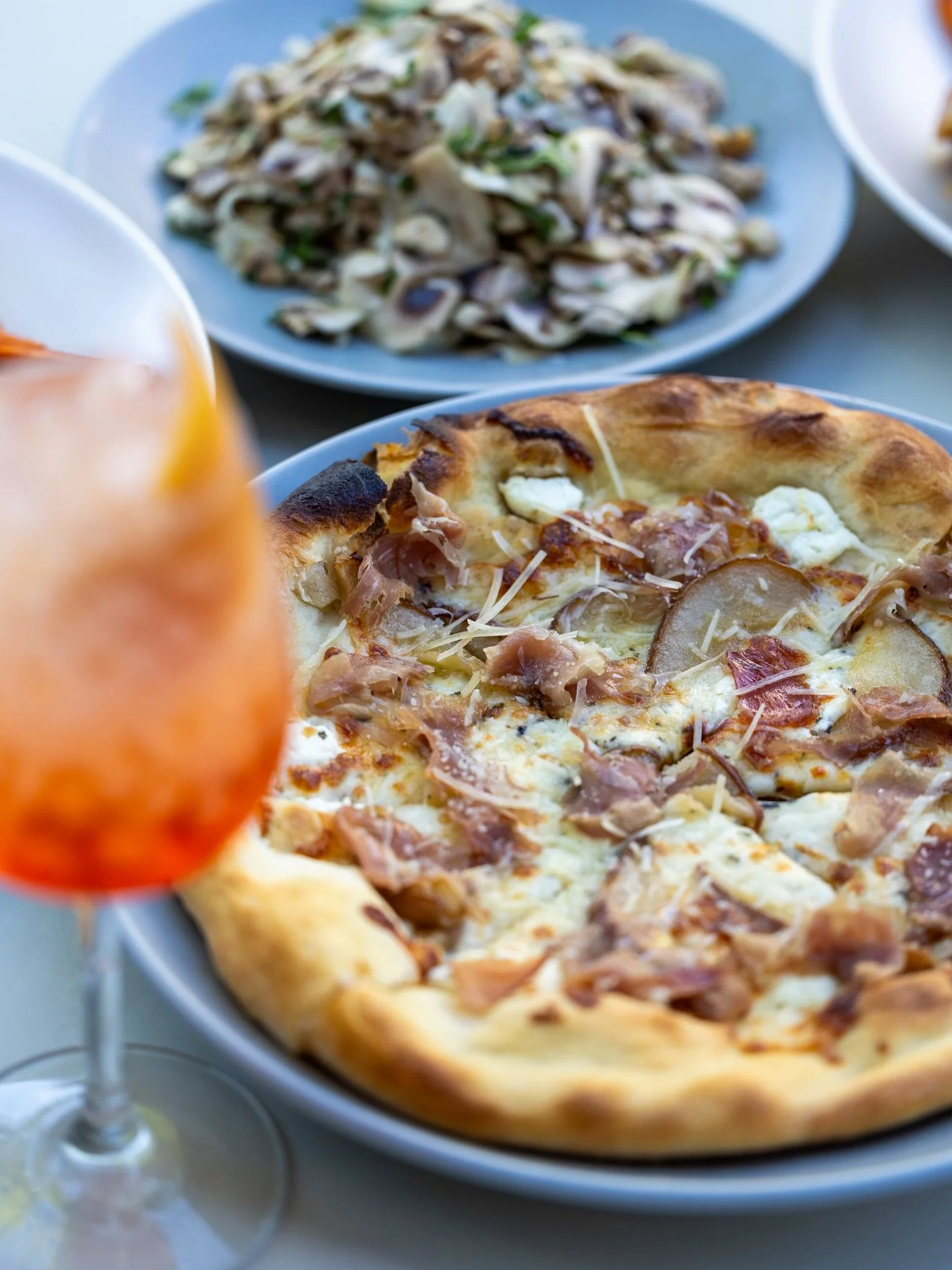 Sweet, savory, and perfectly balanced roasted pear, prosciutto, and a touch of honey.