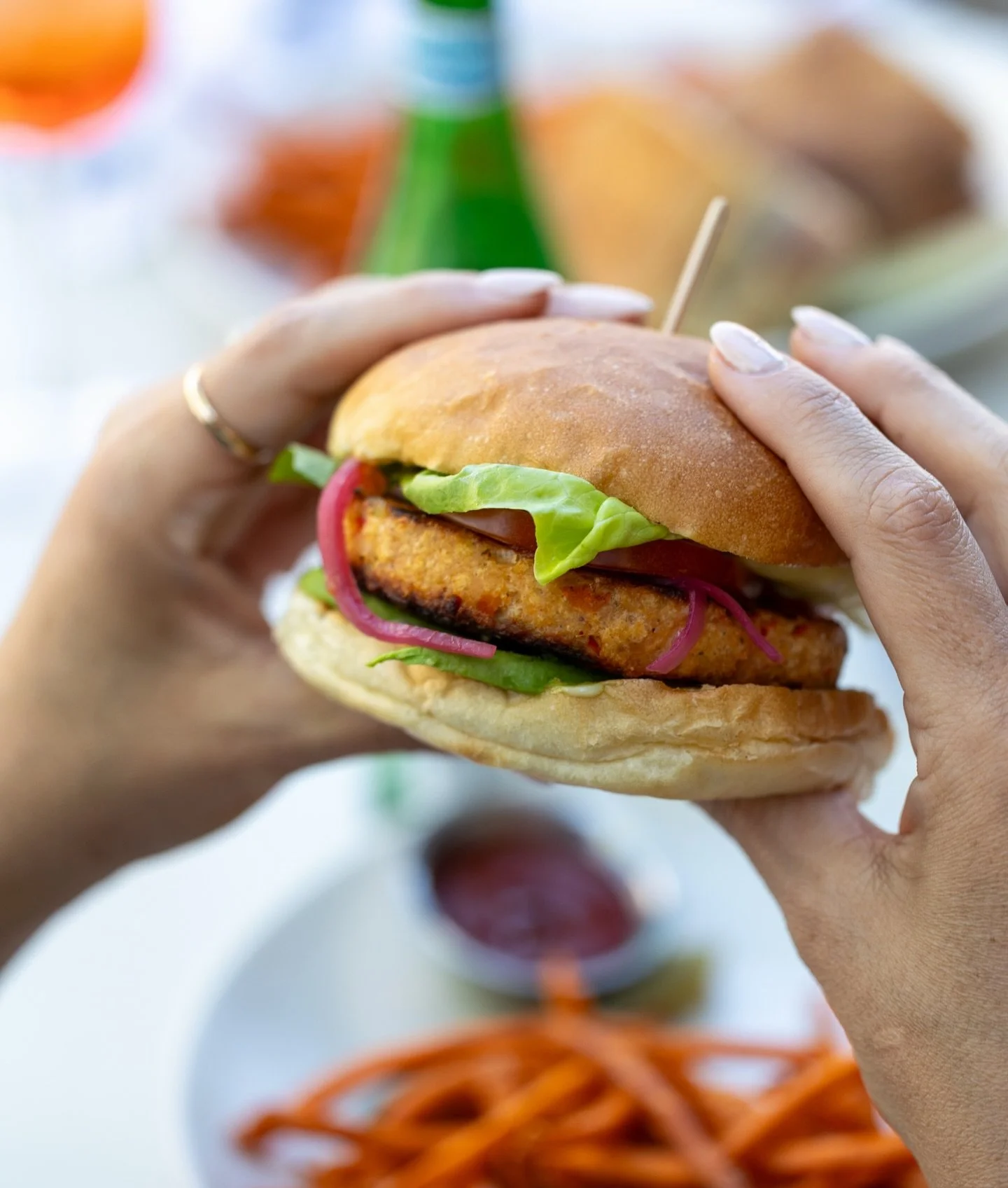 For the burger person craving something a little lighter:
Salmon Burger with avocado, tomato, pickled red onion, butter leaf, and roasted chile mayonnaise.