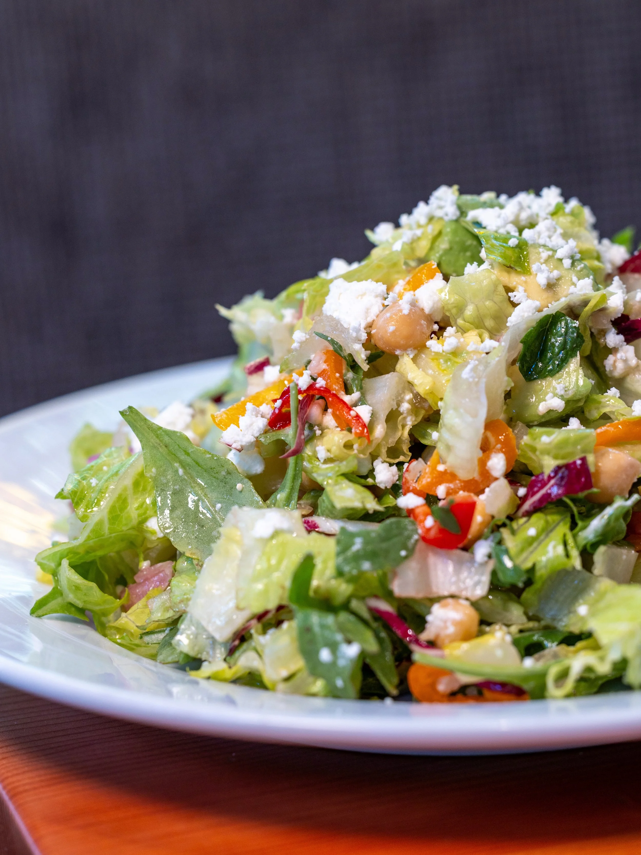 Chickpeas, cucumber, feta, avocado, sweet peppers, mint, and pickled red onion tossed with romaine, arugula, and red wine vinaigrette. Fresh, bright, and exactly what lunch should be.