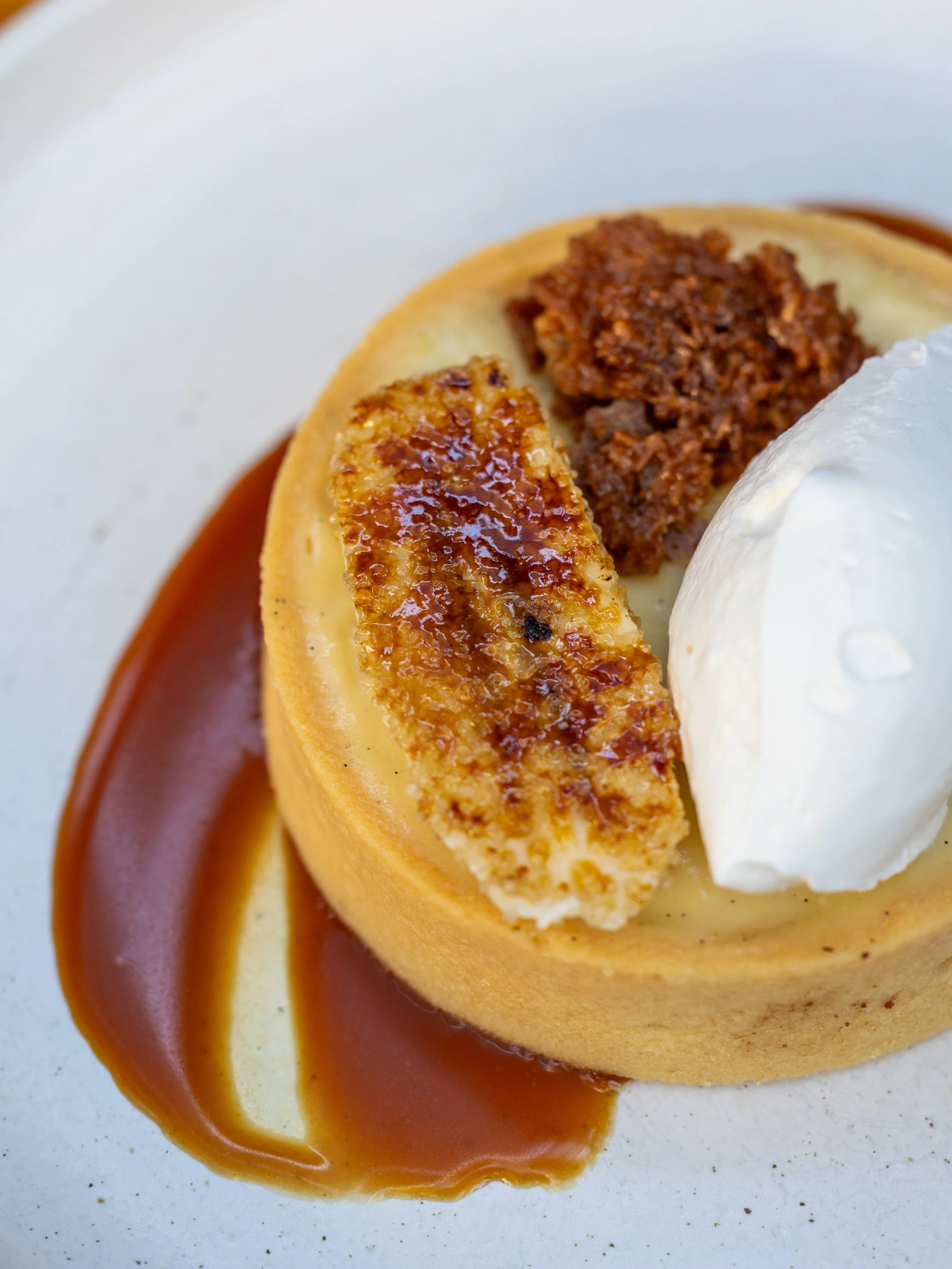 CARAMELIZED BANANA TART 🍌 
vanilla bean custard &bull; white chocolate &bull; caramelized banana &bull; coconut brittle &bull; cr&egrave;me chantilly