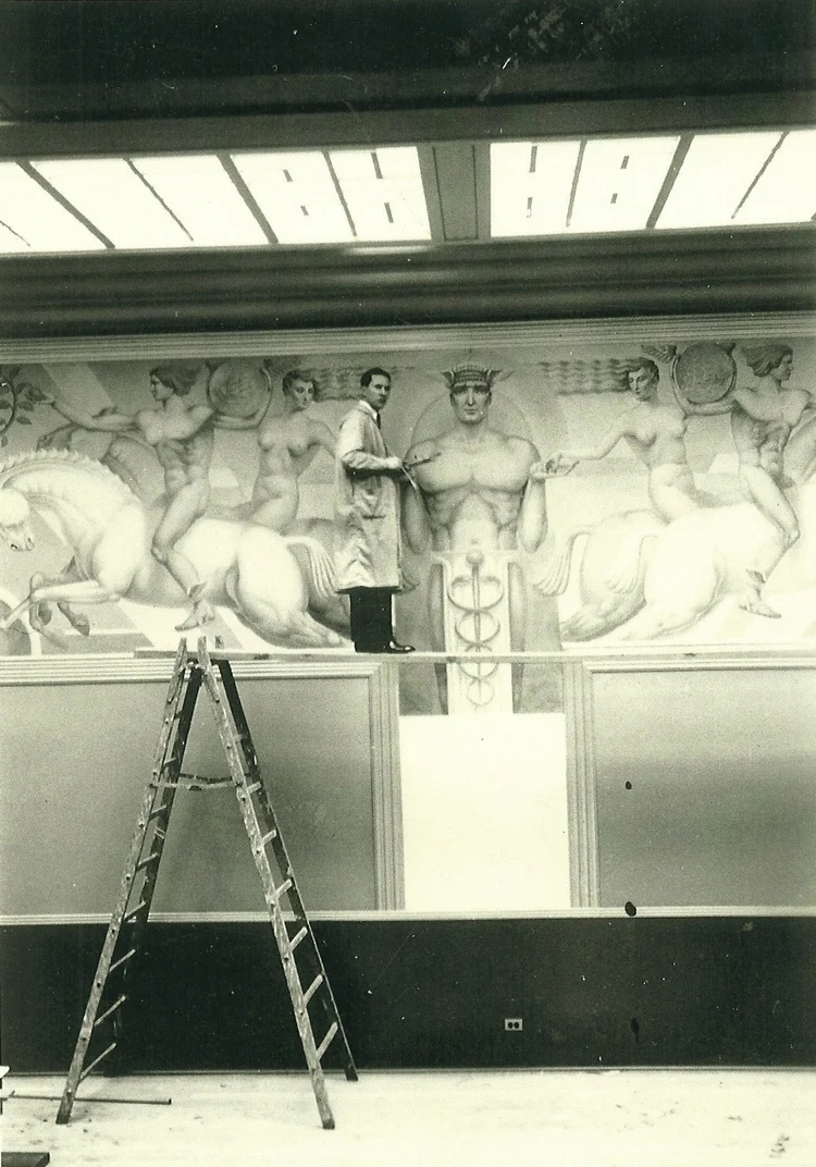 Angelo Lanzini painting a public exhibition mural at Treasure Island