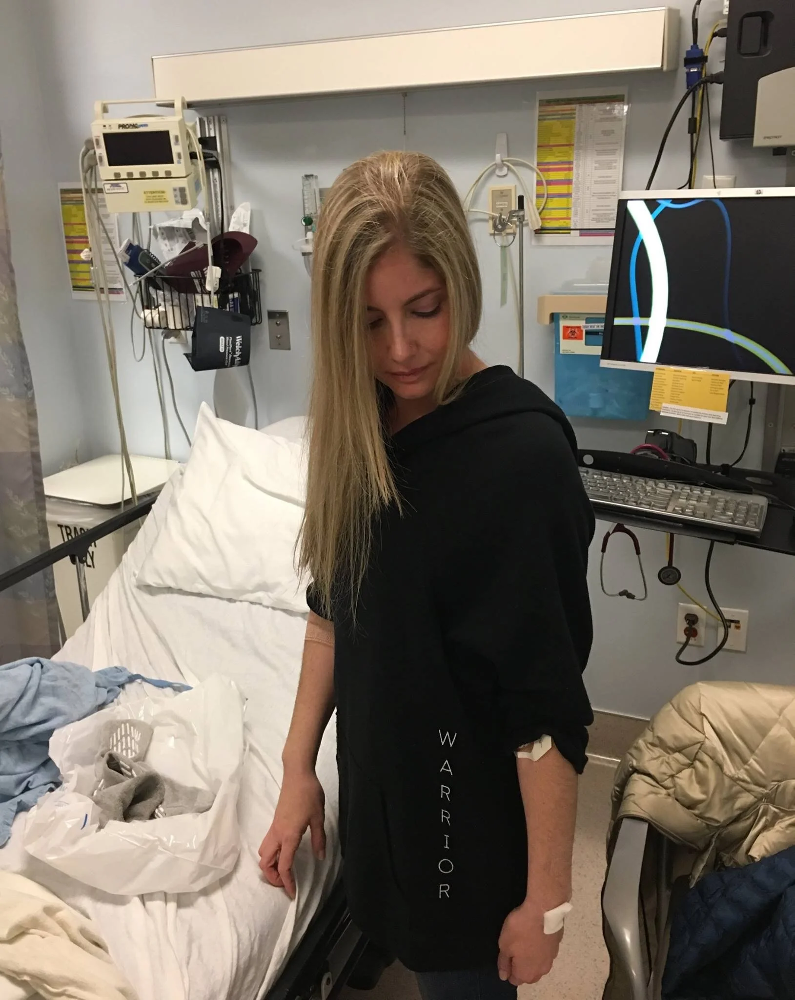 After a procedure with warrior shirt.JPG