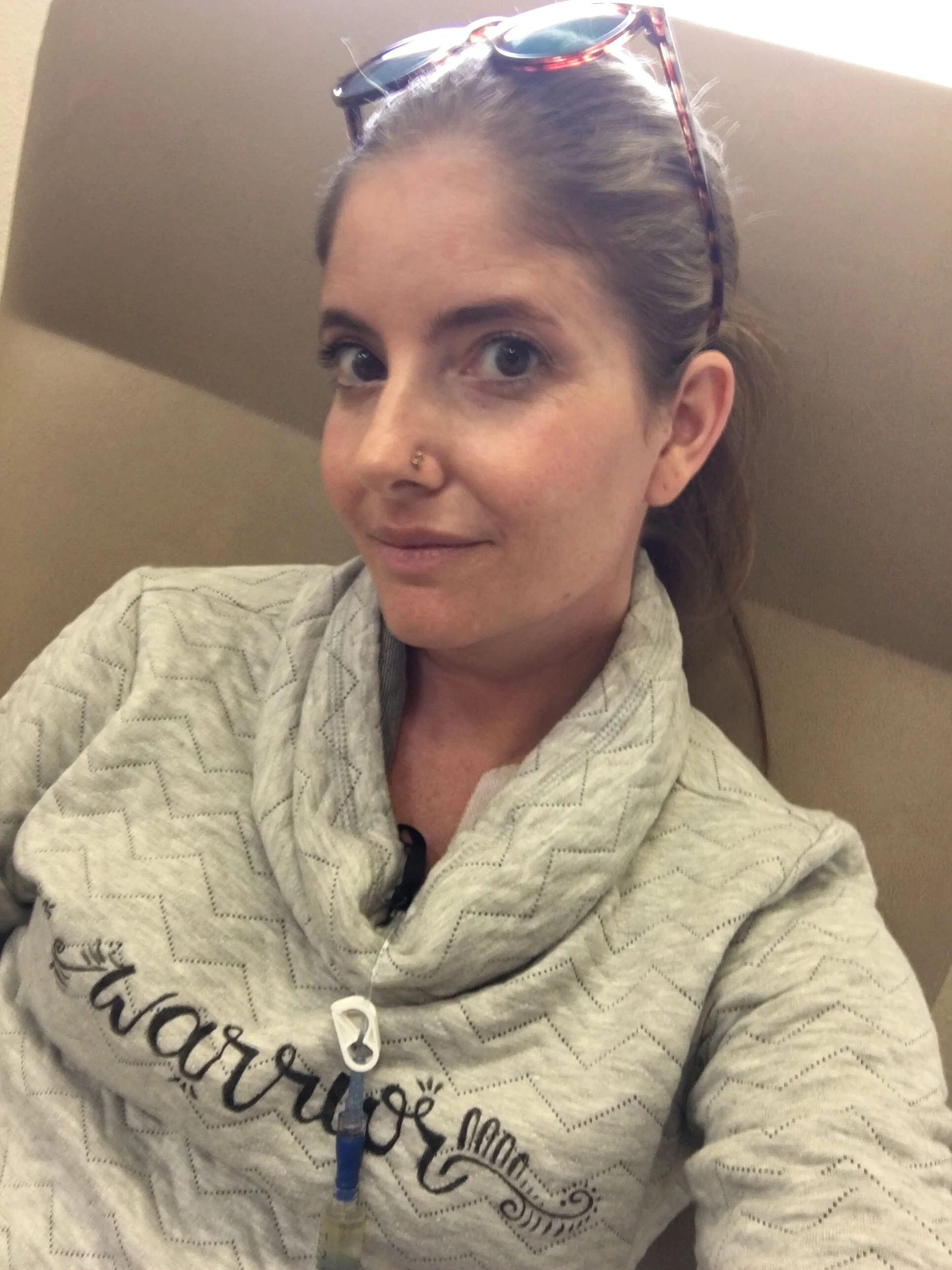 Receiving IV antibiotics through port, warrior shirt.JPG