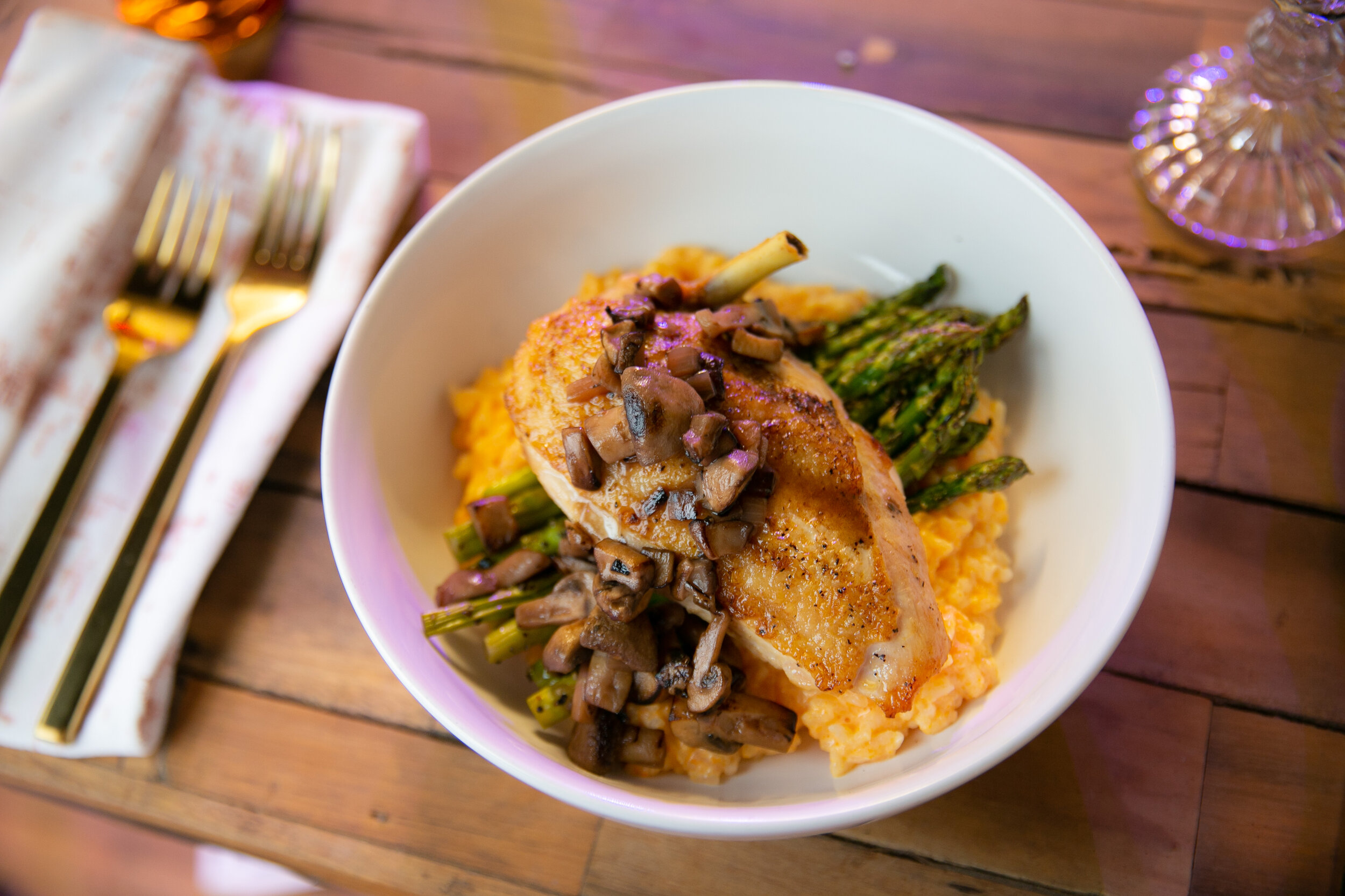 SAGE ROASTED CHICKEN MADERIA WINE SAUCE SHIITAKE MUSHROOMS OVER ASPARAGUS AND RICE