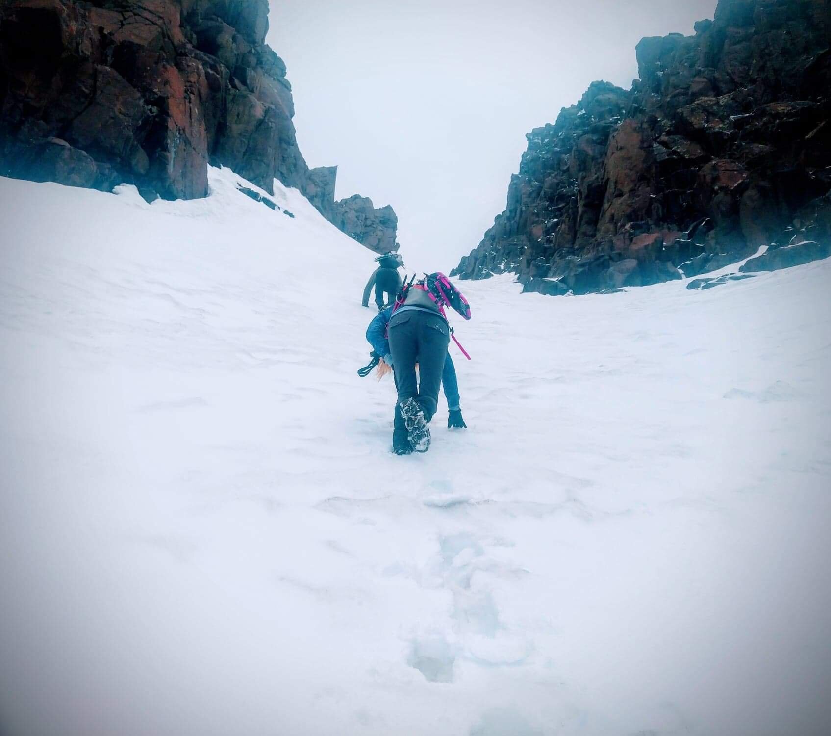A quick snow storm while we climb scree