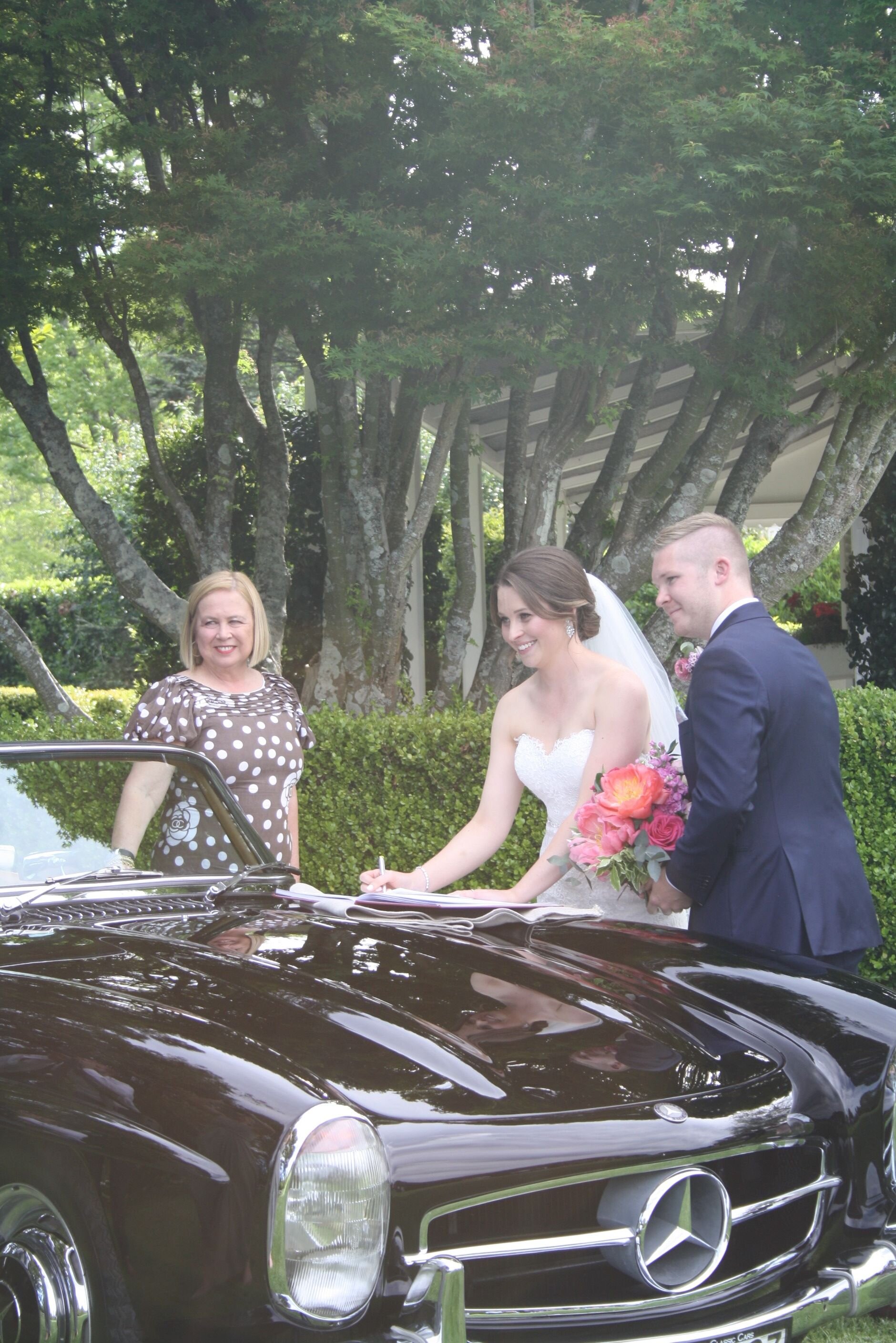 Happy shot of signing on bonnet.jpg