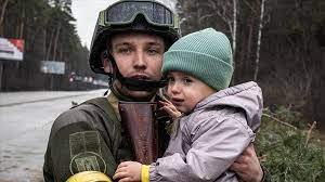 Corpsman and kid.jpeg